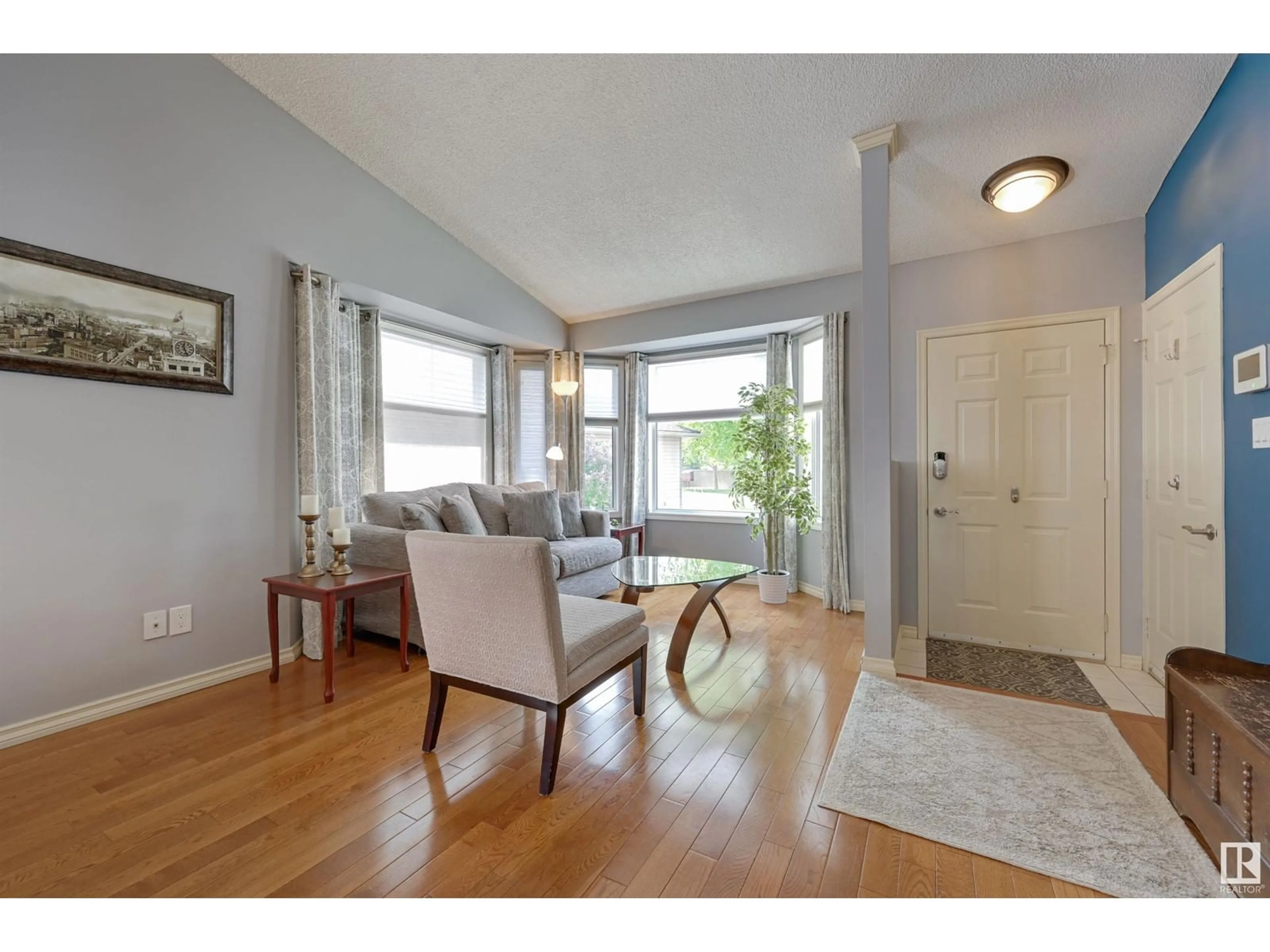 Living room with furniture, wood/laminate floor for 519 RAINBOW CR, Sherwood Park Alberta T8A5M8