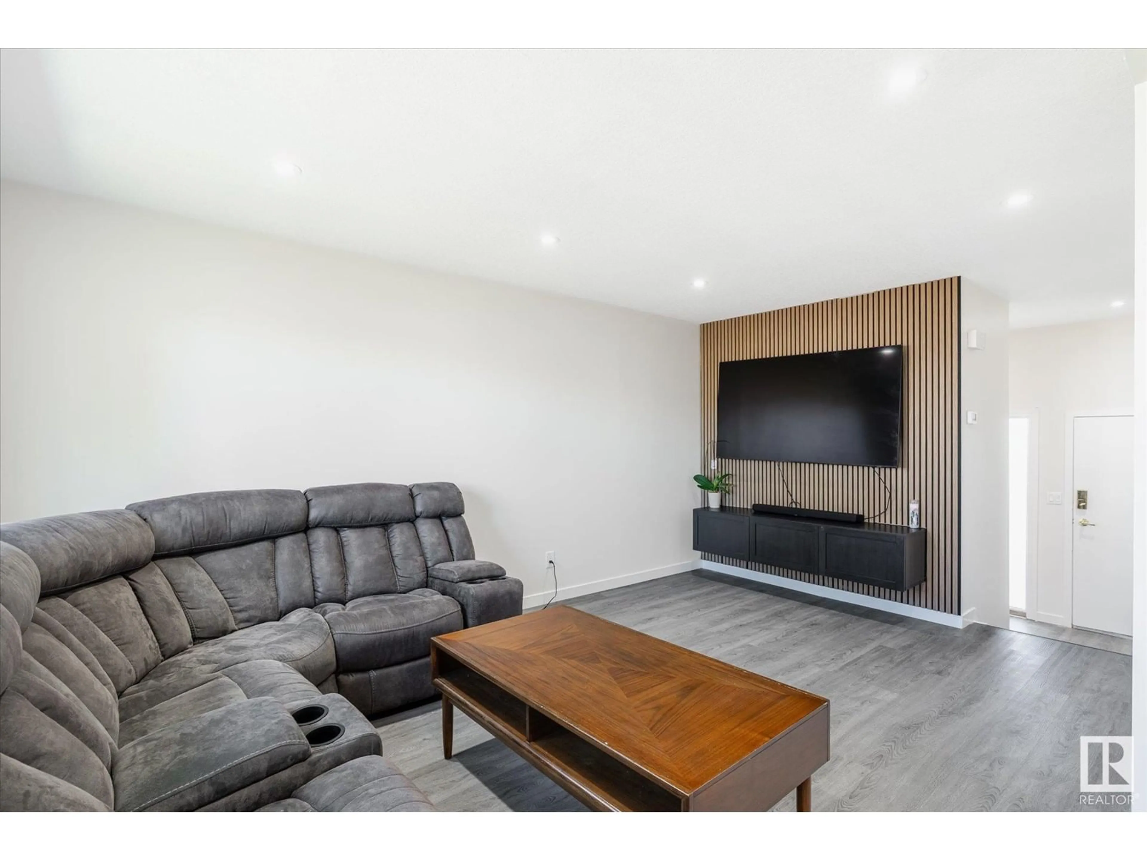 Living room with furniture, wood/laminate floor for 206 CALLINGWOOD PL, Edmonton Alberta T5T2C6