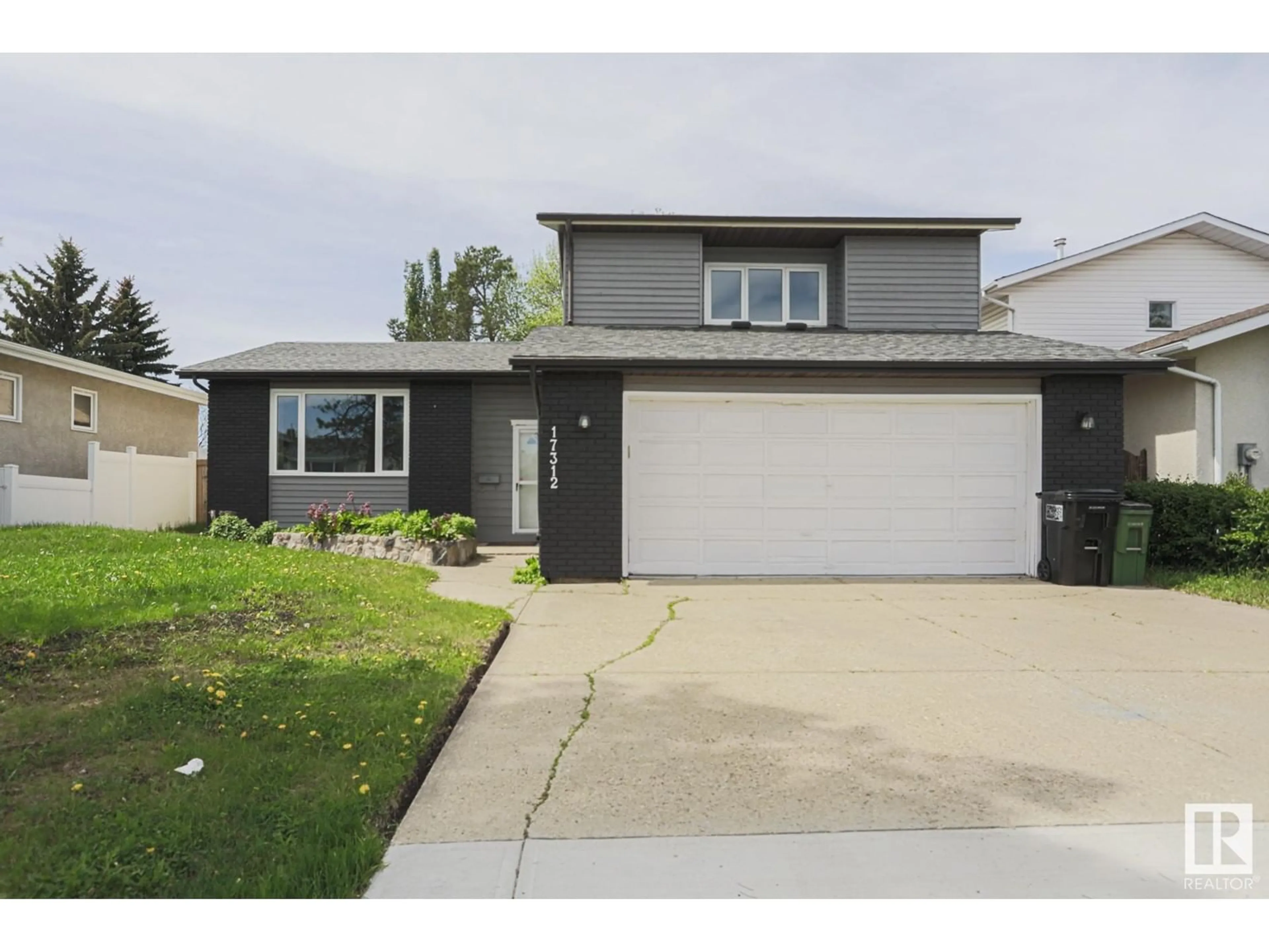 Home with vinyl exterior material, street for 17312 111 ST, Edmonton Alberta T5X3J8