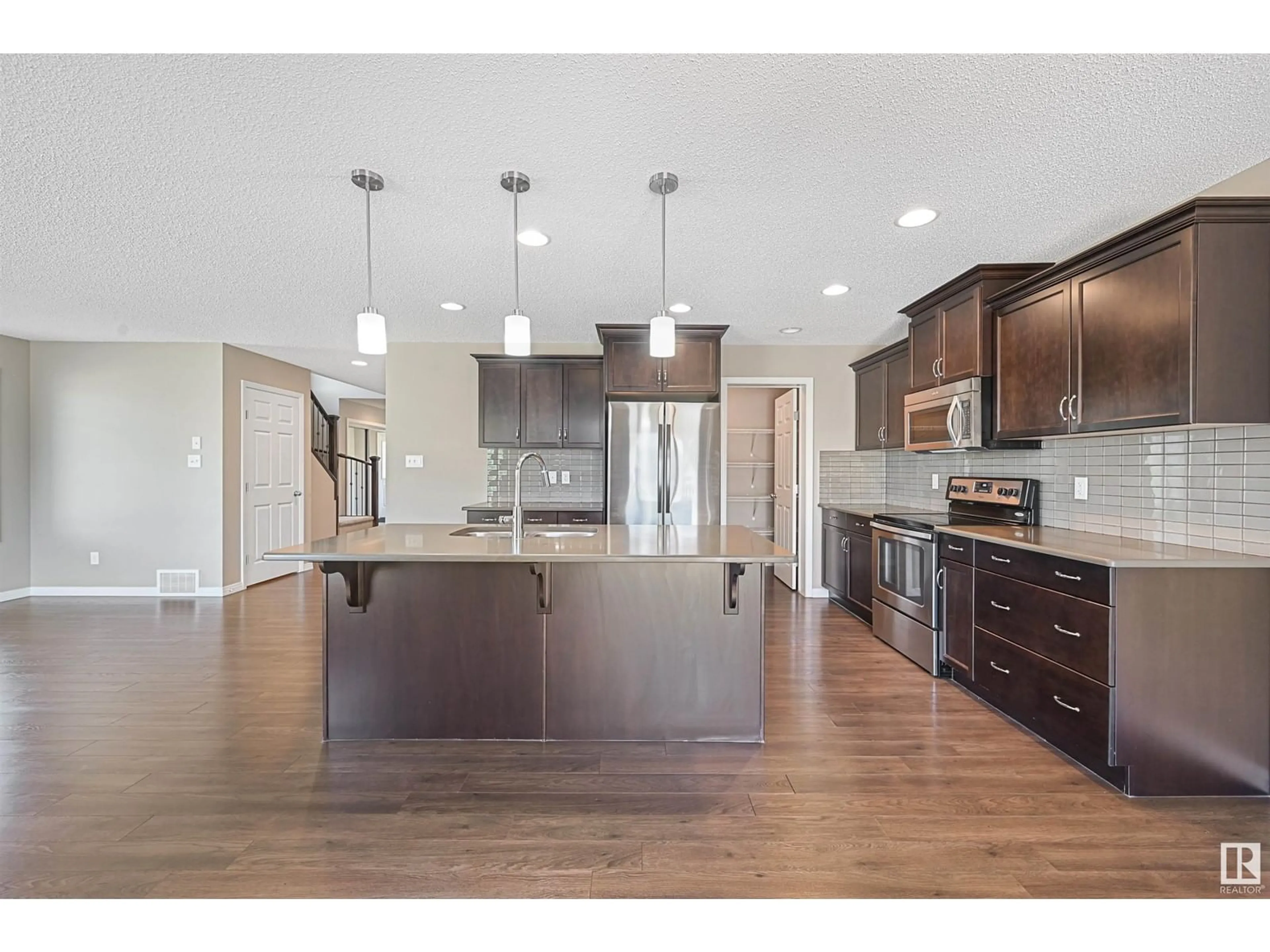 Open concept kitchen, wood/laminate floor for 3520 CLAXTON CR, Edmonton Alberta T6W0Z6