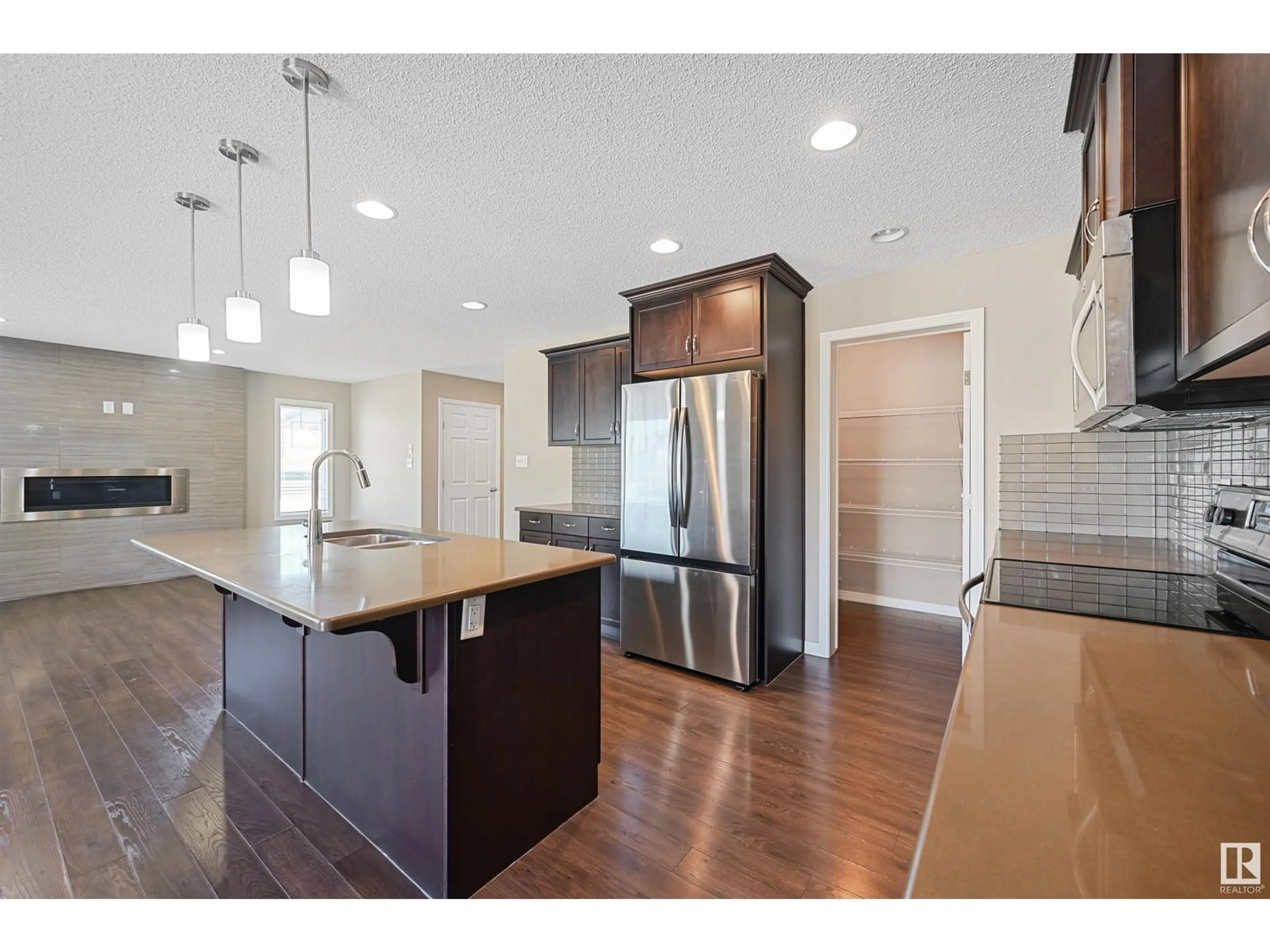 Open concept kitchen, wood/laminate floor for 3520 CLAXTON CR, Edmonton Alberta T6W0Z6