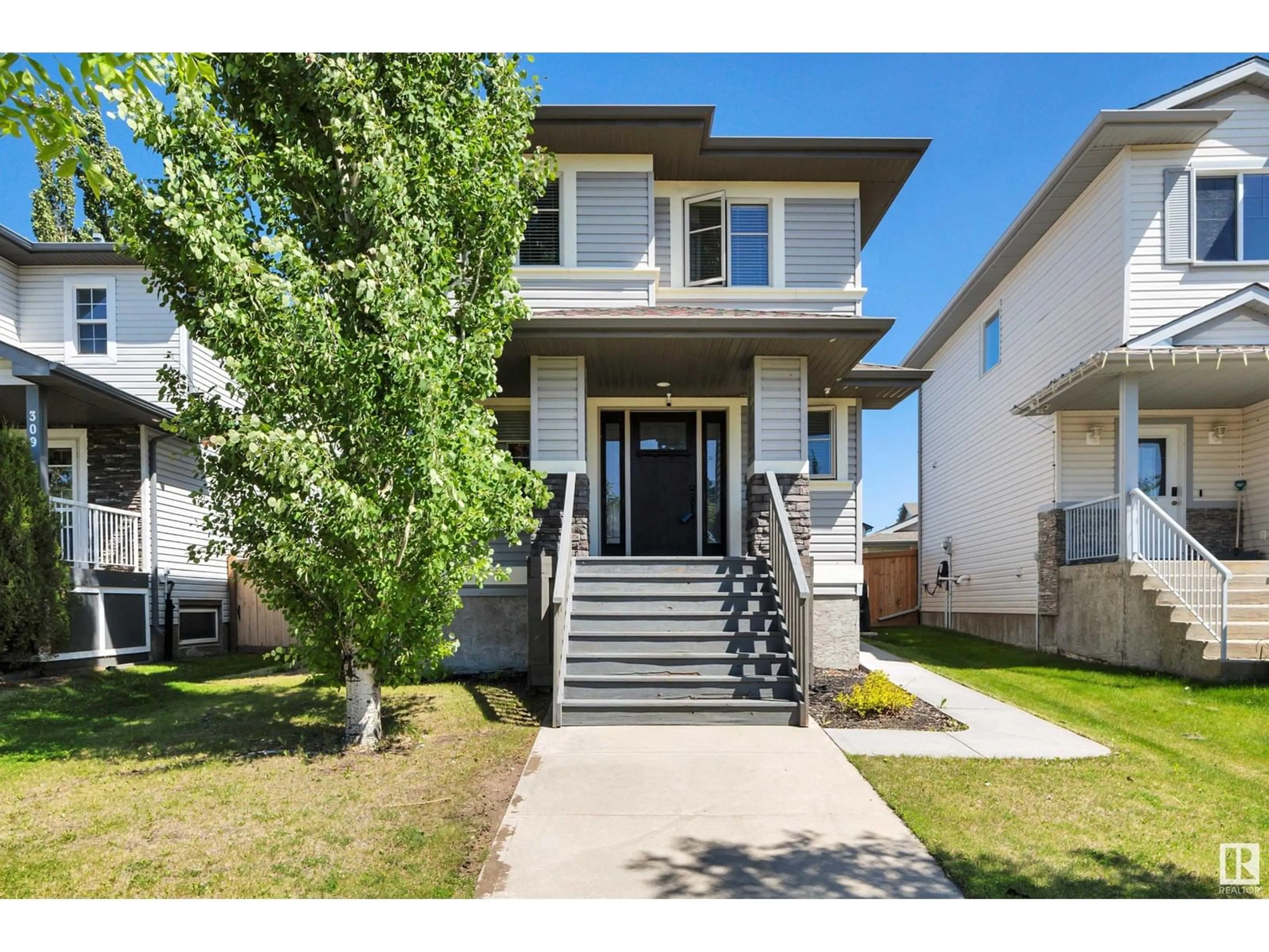 Home with vinyl exterior material, street for 307 AVENA LI, Leduc Alberta T9E0L8