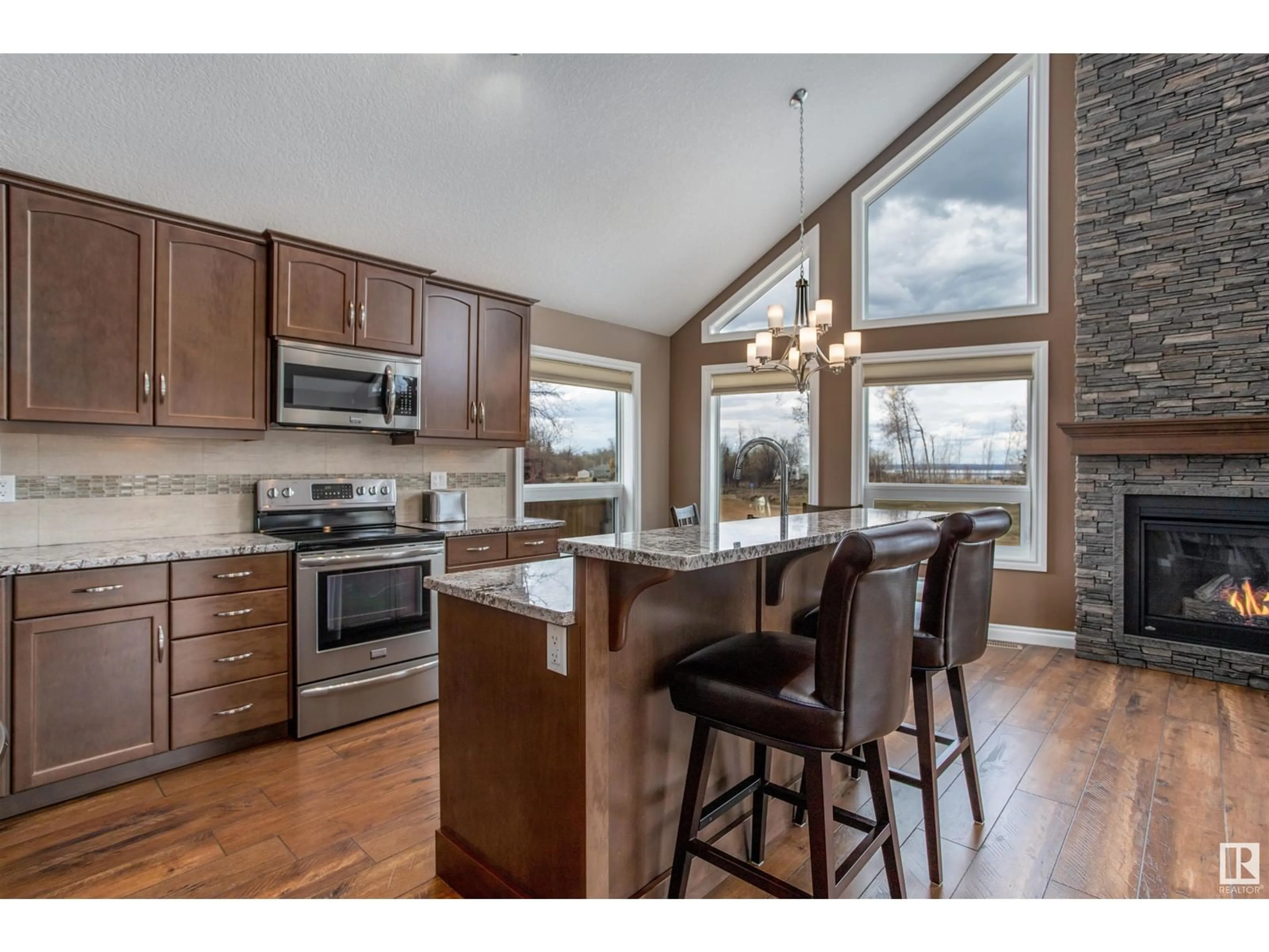 Open concept kitchen, wood/laminate floor for 162 - 219 PEACE RIVER AV, Joussard Alberta T0G1J0