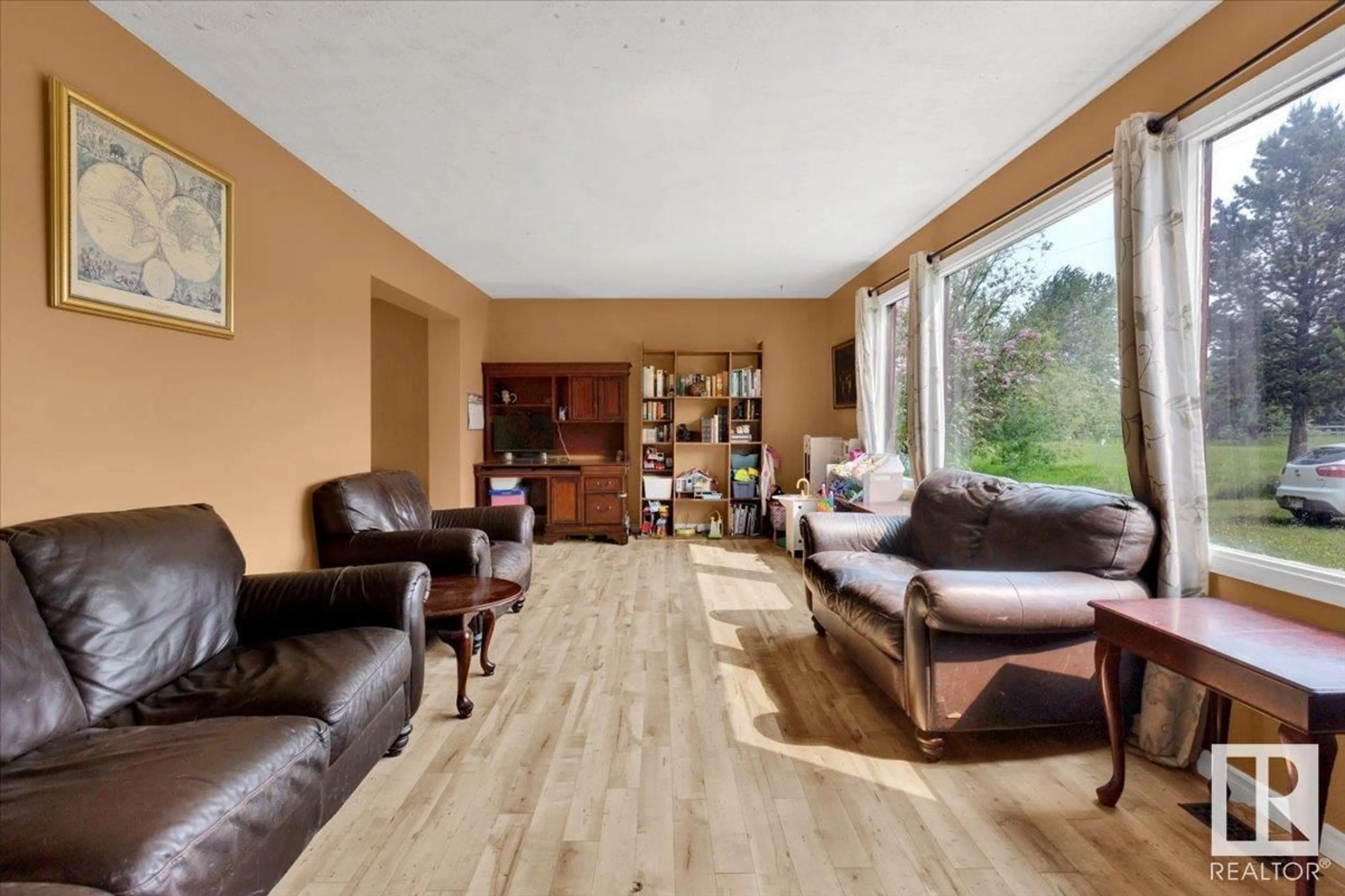 Living room with furniture, wood/laminate floor for 23429 - 8 TWP RD 584, Rural Westlock County Alberta T0G1L0