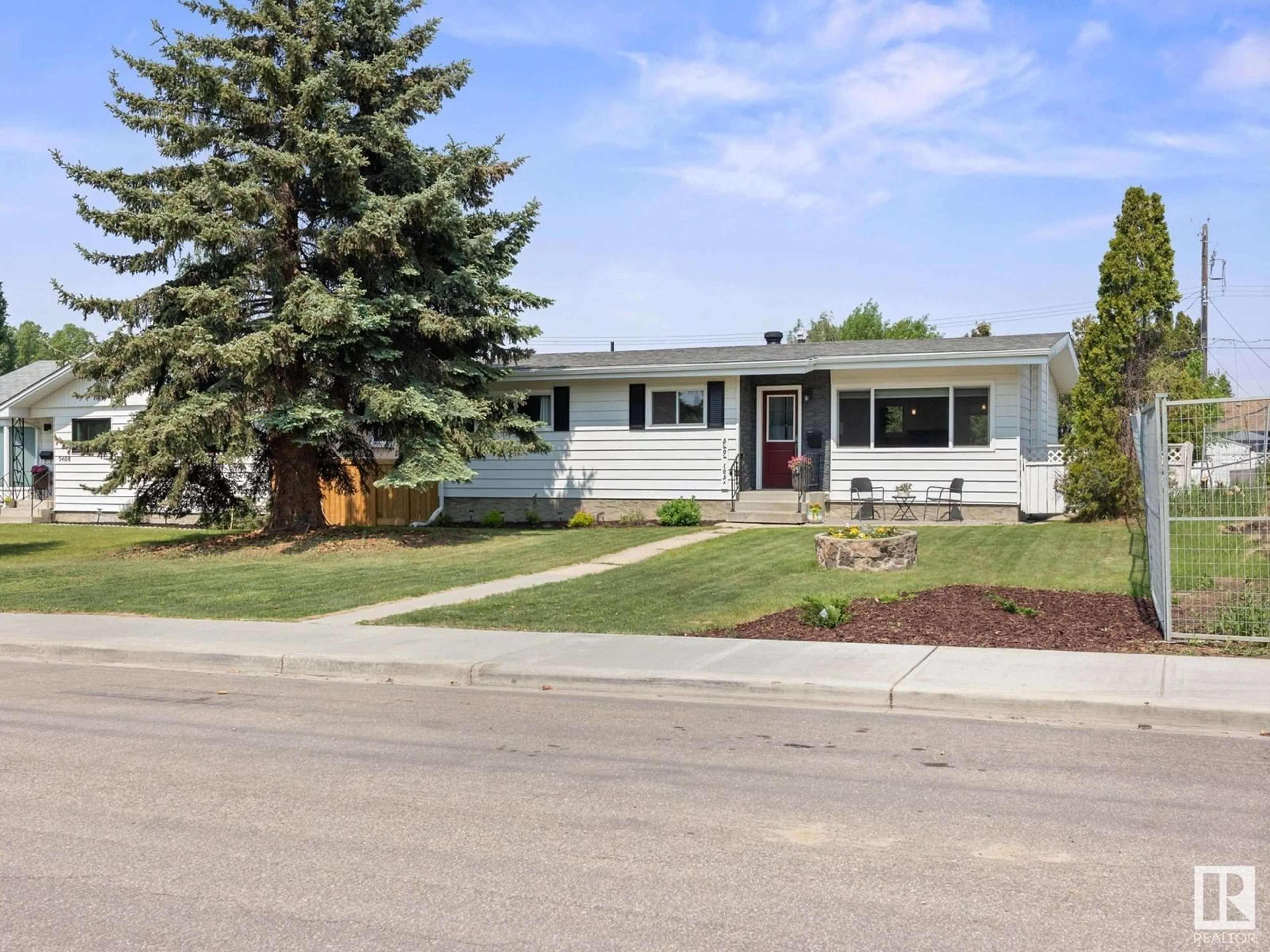 Home with vinyl exterior material, street for 5404 103A AV, Edmonton Alberta T6A0W6