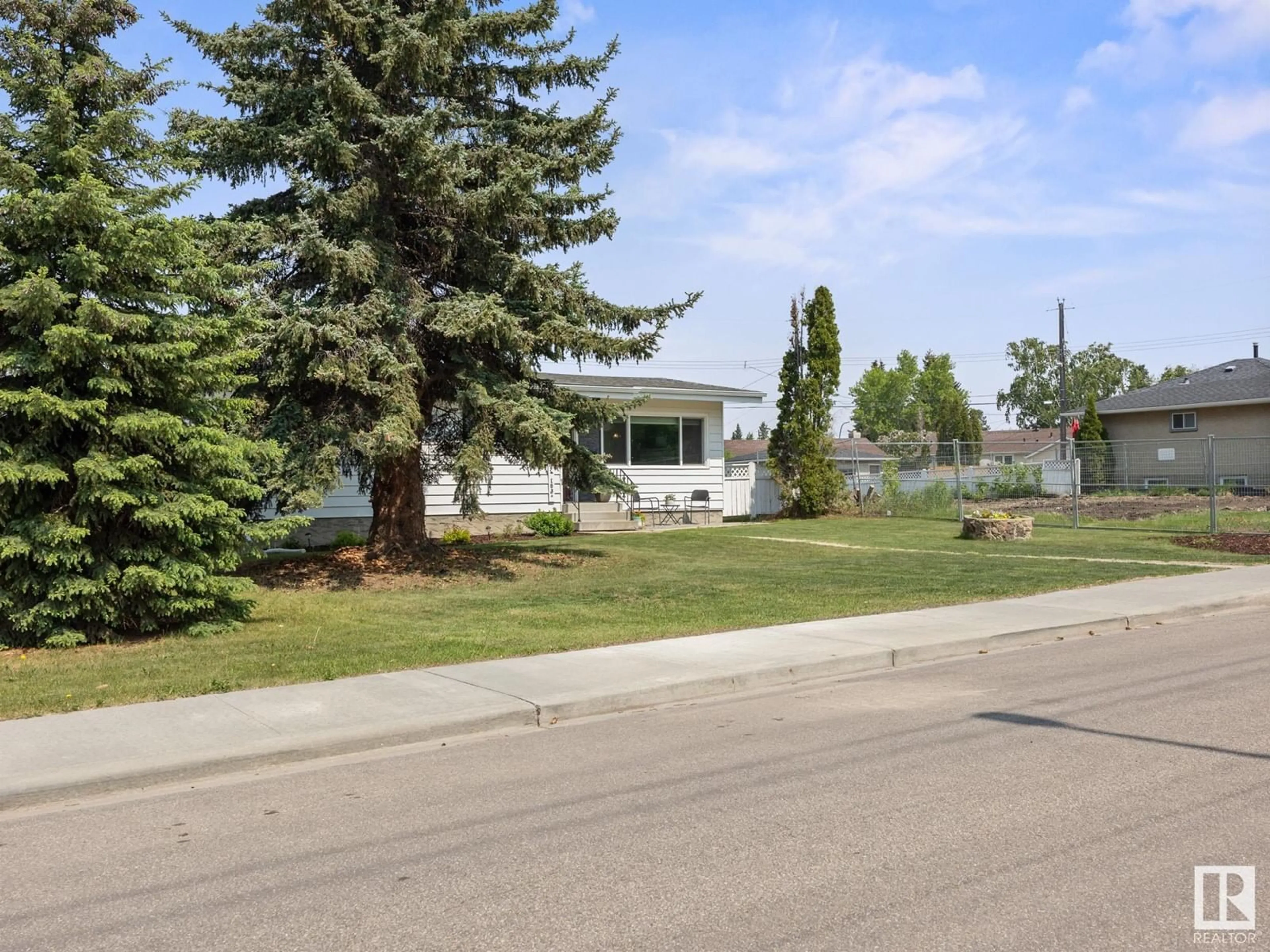 Home with vinyl exterior material, street for 5404 103A AV, Edmonton Alberta T6A0W6