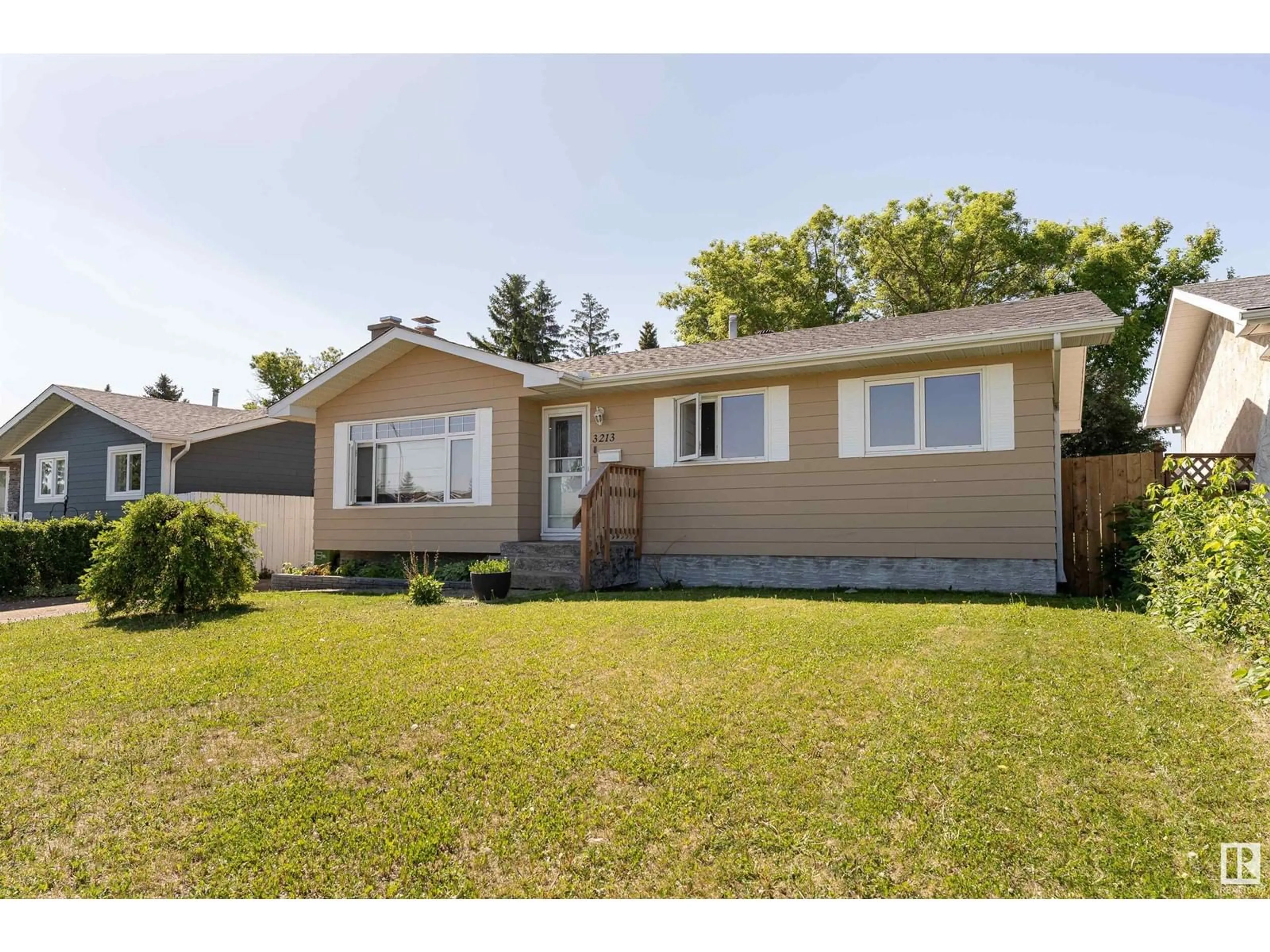Home with vinyl exterior material, street for 3213 130A AV, Edmonton Alberta T5A3B6