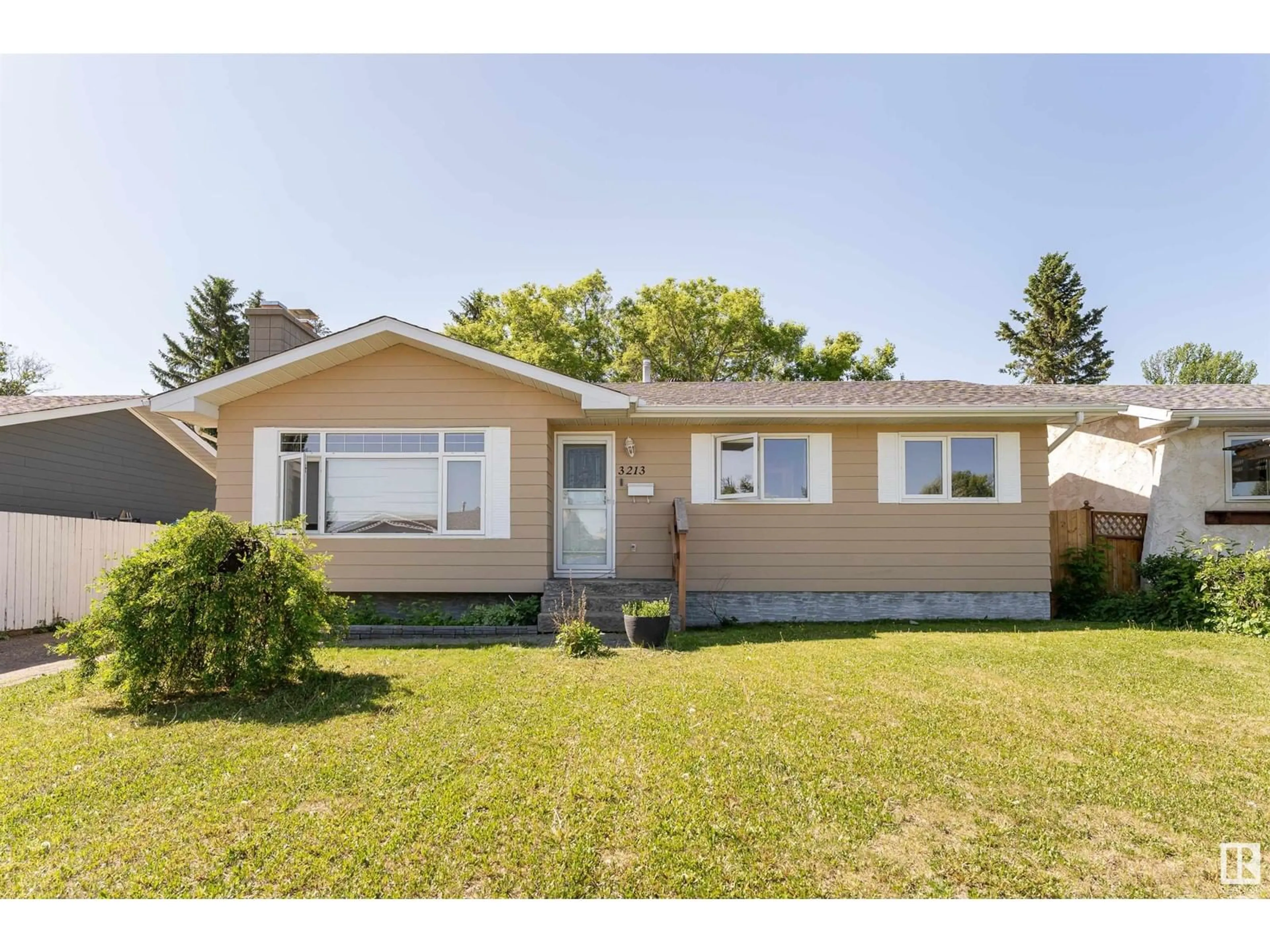 Home with vinyl exterior material, street for 3213 130A AV, Edmonton Alberta T5A3B6