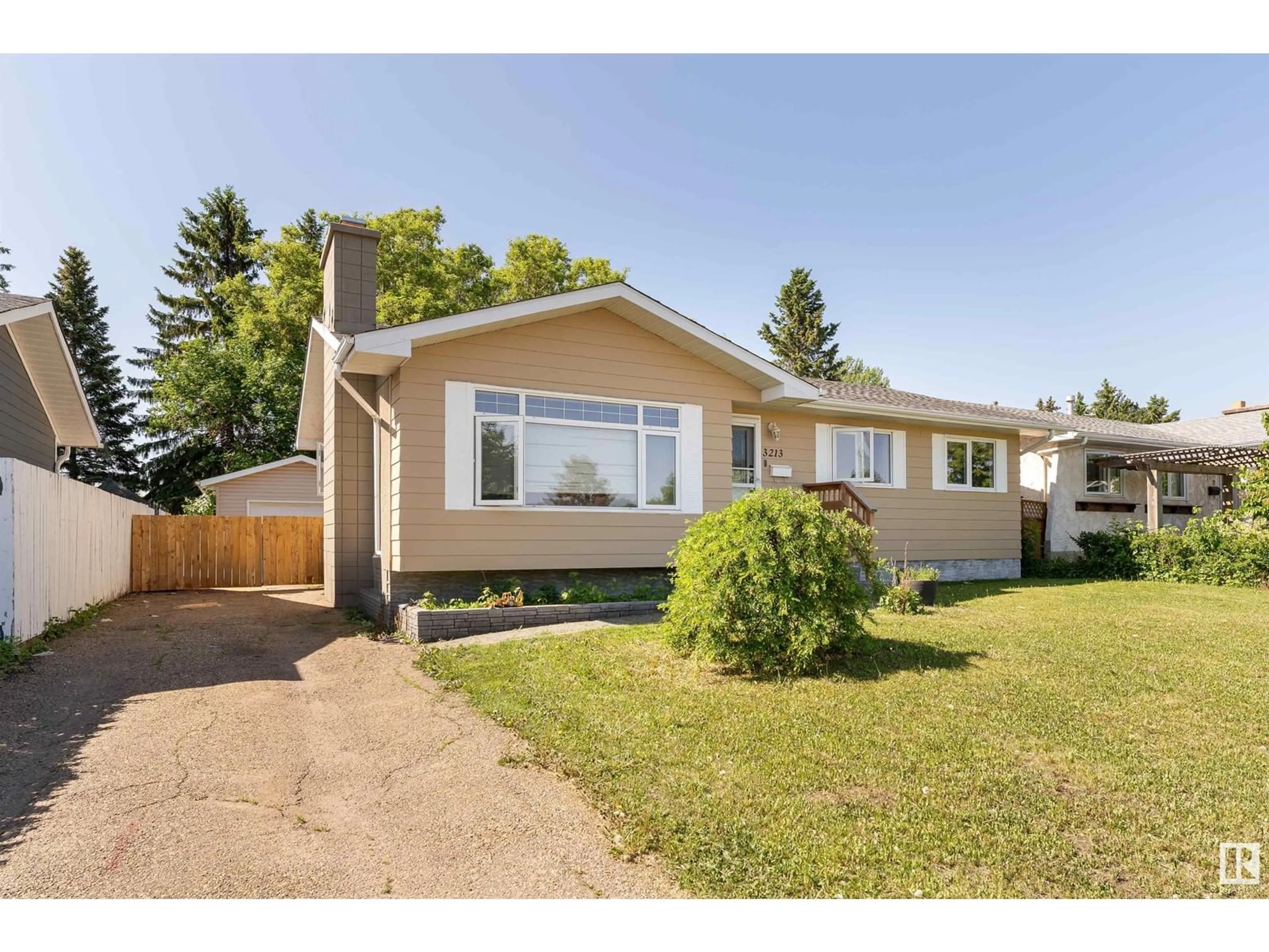 Home with vinyl exterior material, street for 3213 130A AV, Edmonton Alberta T5A3B6