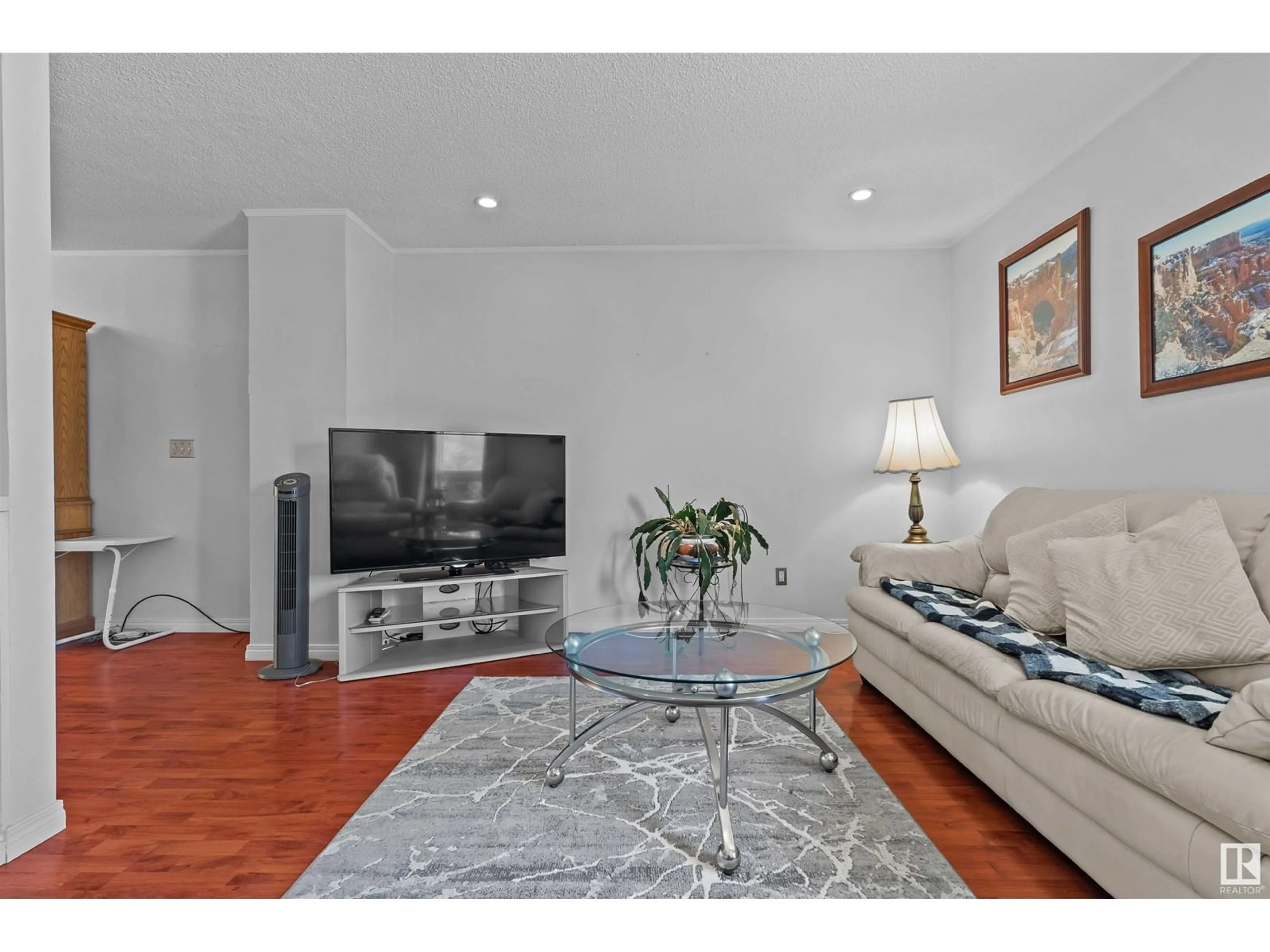 Living room with furniture, wood/laminate floor for 10416 98 AV, Morinville Alberta T8R1C8