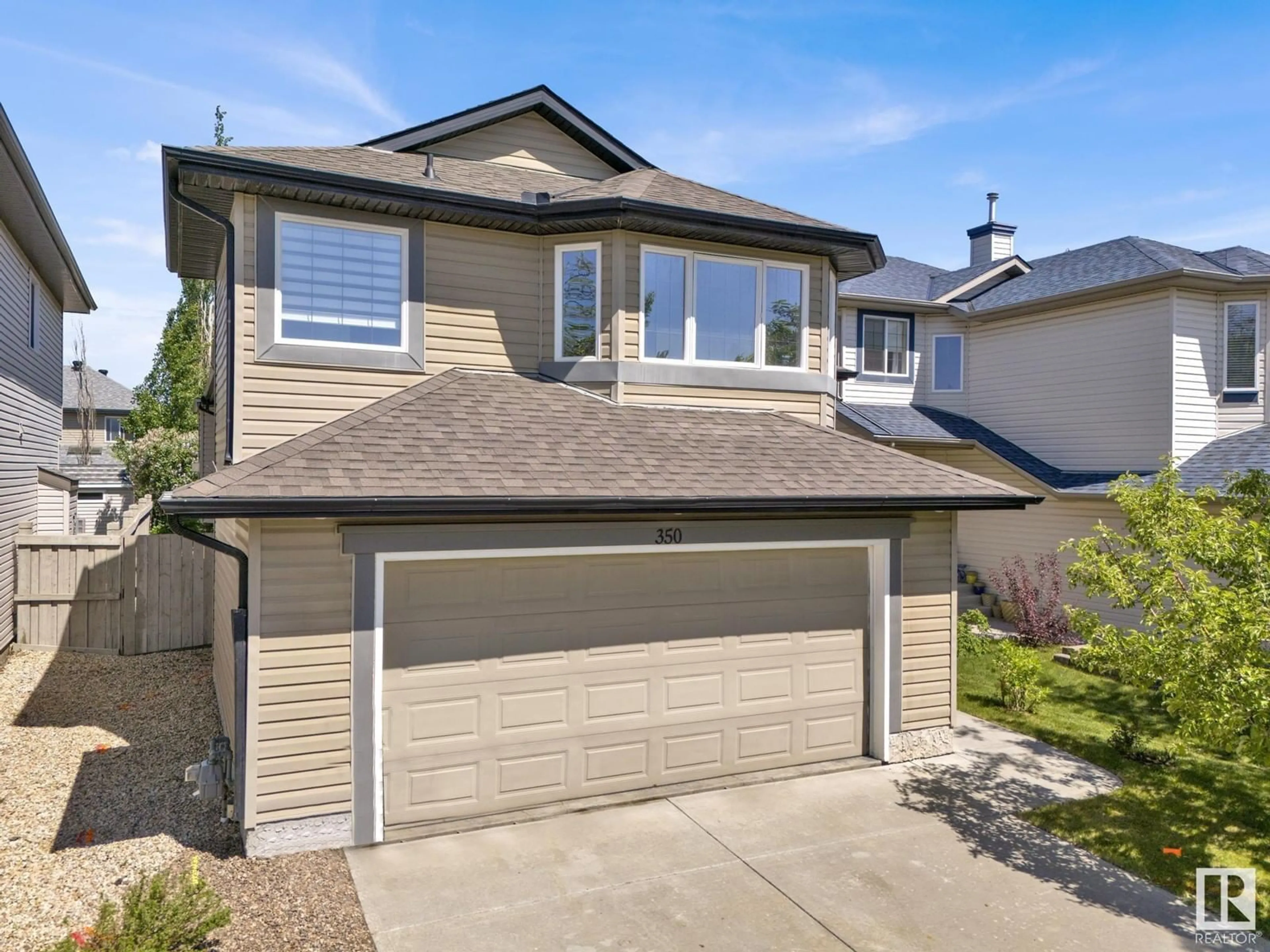 Home with vinyl exterior material, street for 350 MACEWAN RD, Edmonton Alberta T6W1V5