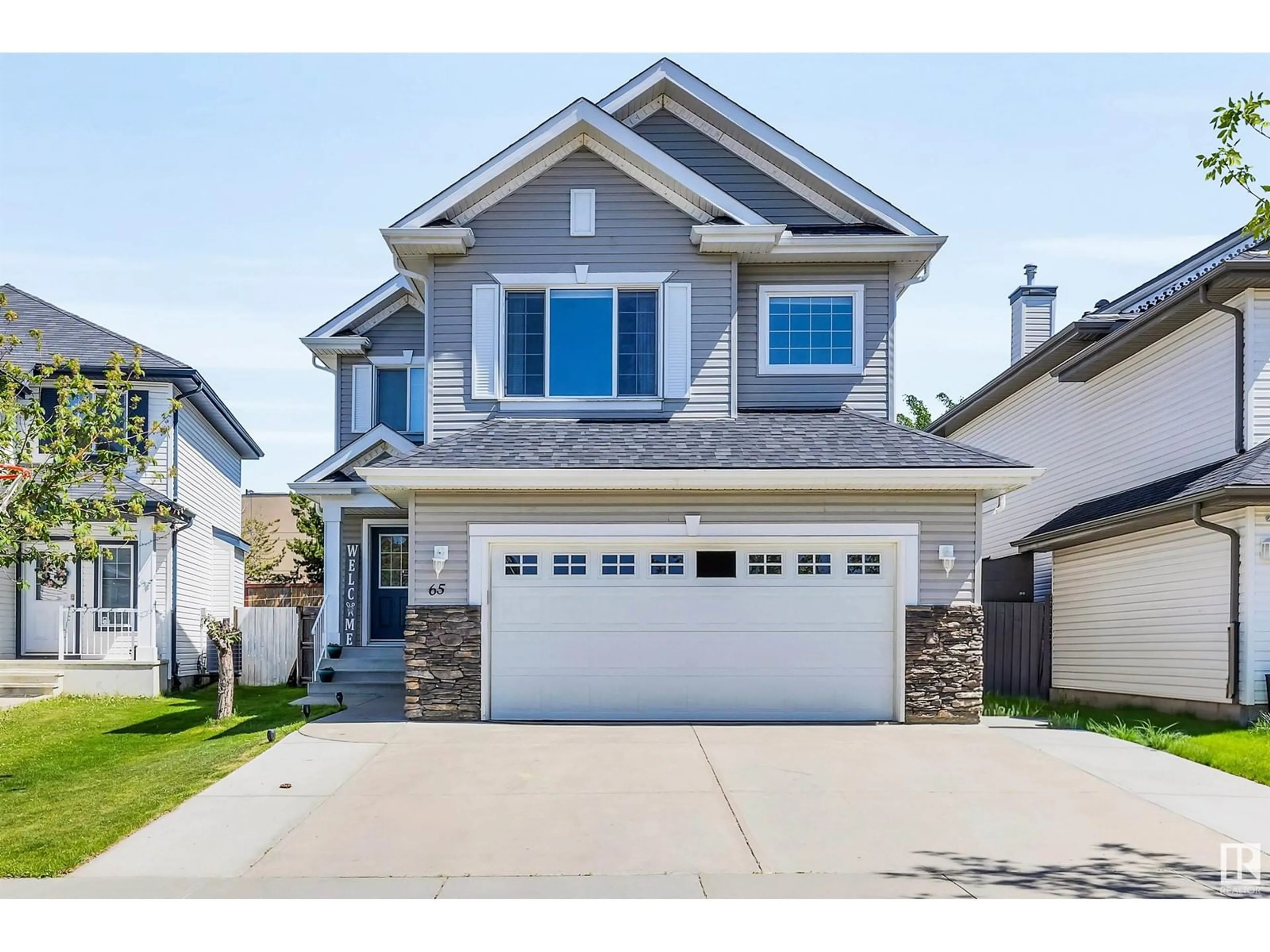 Home with vinyl exterior material, street for 65 RUE MONETTE ST, Beaumont Alberta T4X1T2