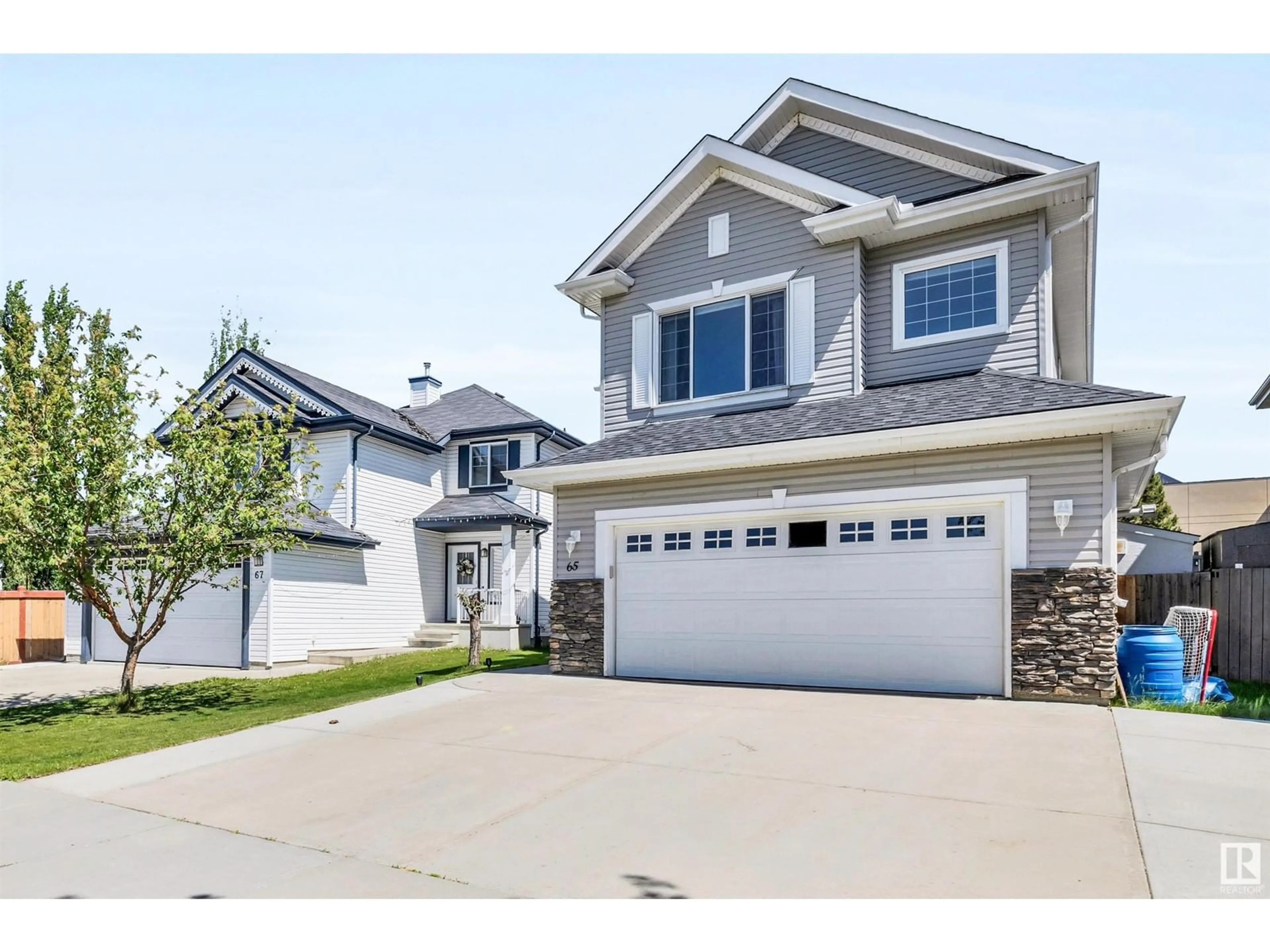 Home with vinyl exterior material, street for 65 RUE MONETTE ST, Beaumont Alberta T4X1T2