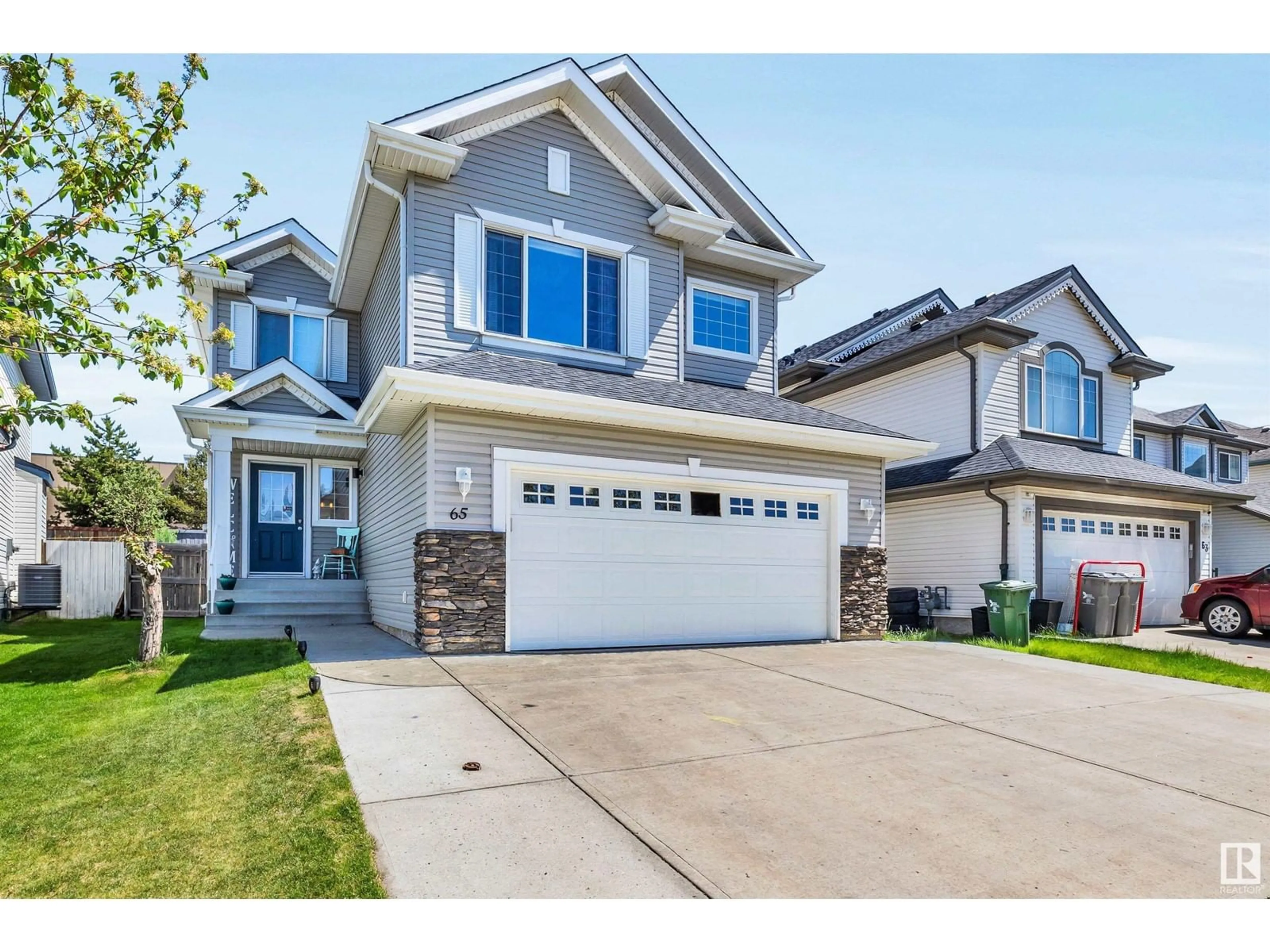 Home with vinyl exterior material, street for 65 RUE MONETTE ST, Beaumont Alberta T4X1T2