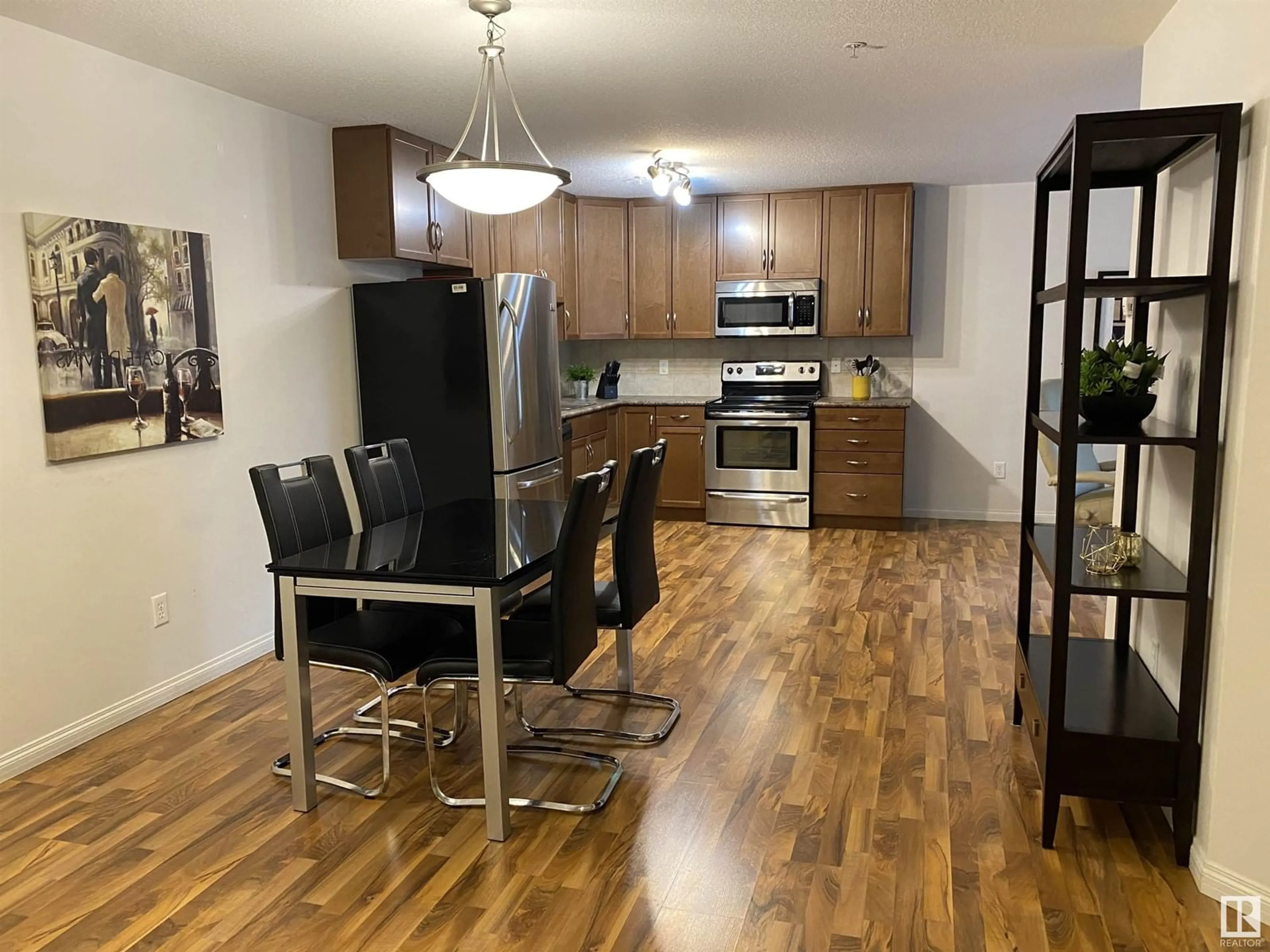Open concept kitchen, wood/laminate floor for #216 - 1204 156 ST, Edmonton Alberta T6R0R6
