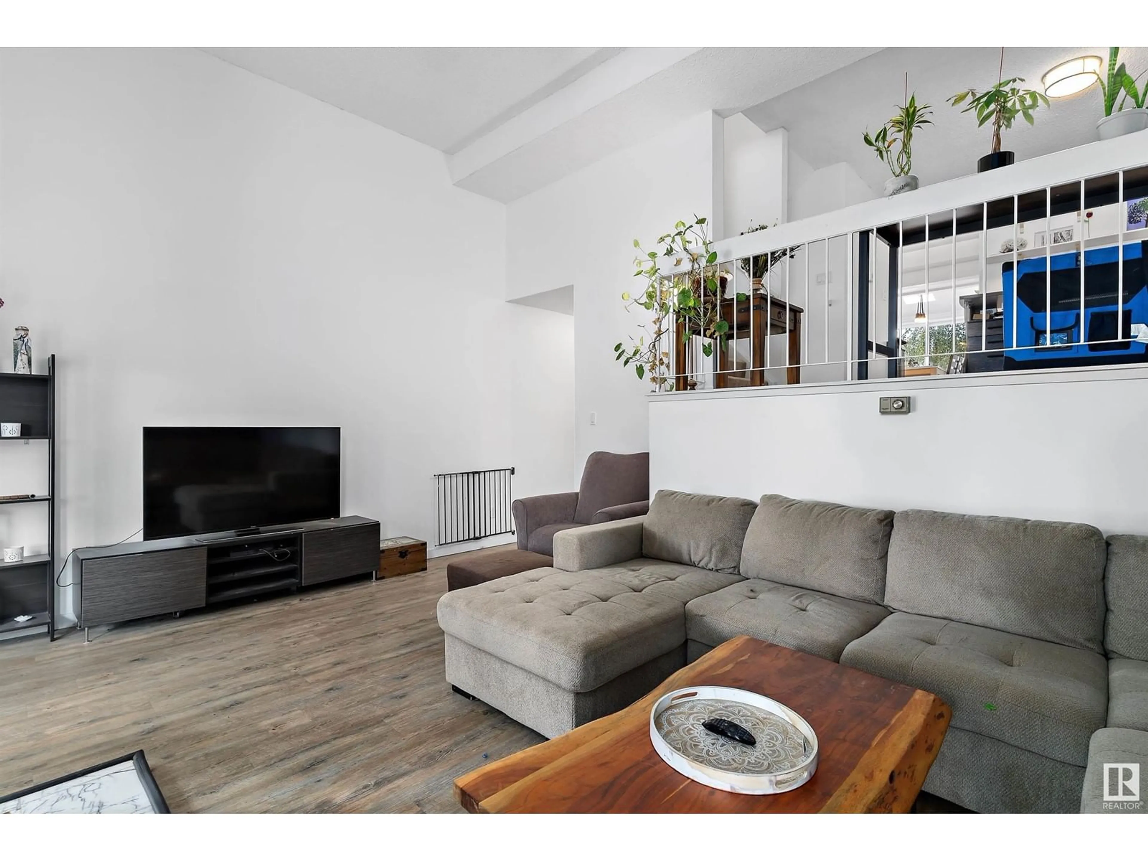 Living room with furniture, wood/laminate floor for 3016 108 ST, Edmonton Alberta T6J3S6