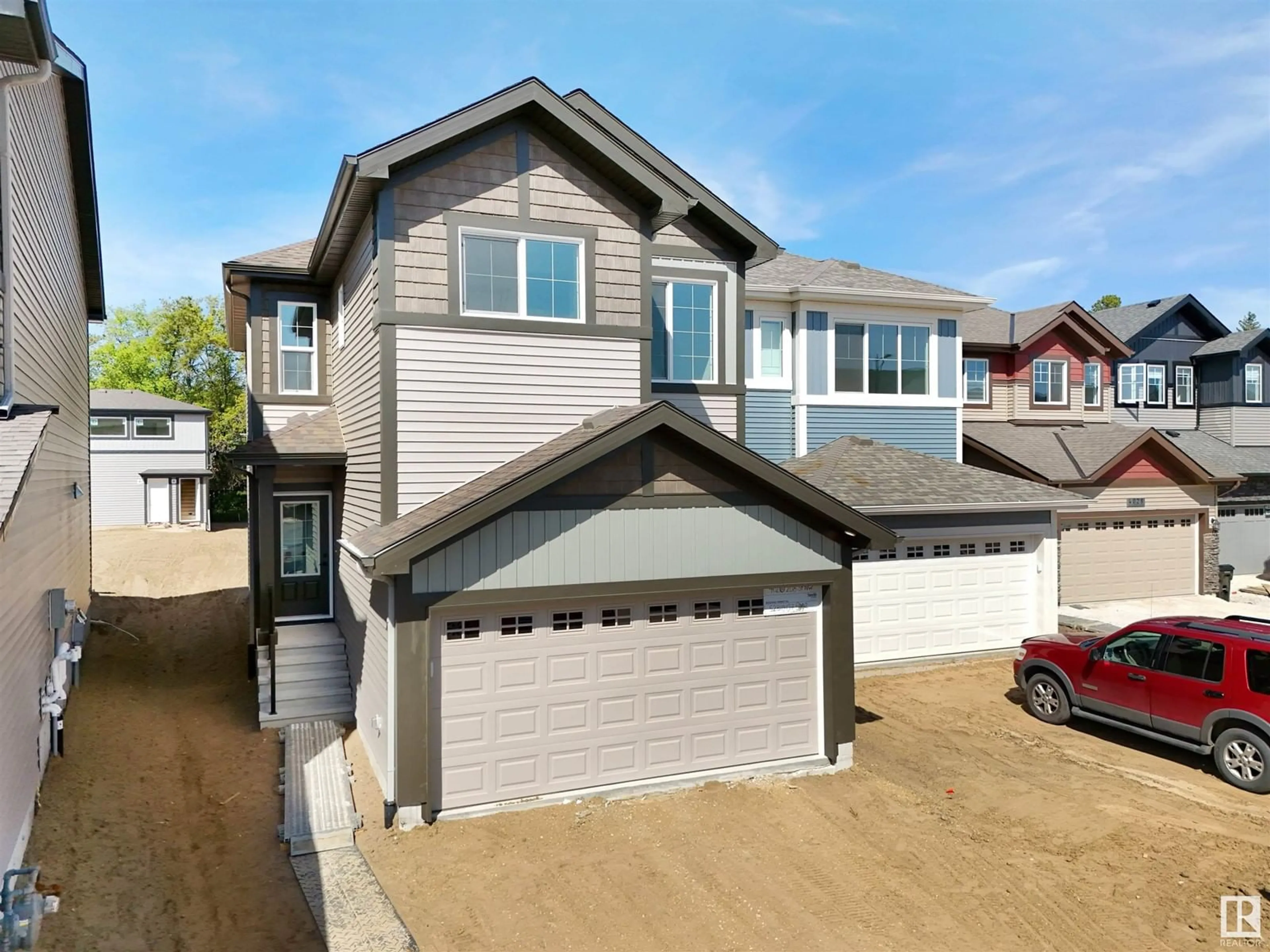 Home with vinyl exterior material, street for NW - 4020 208 ST, Edmonton Alberta T6M3E4