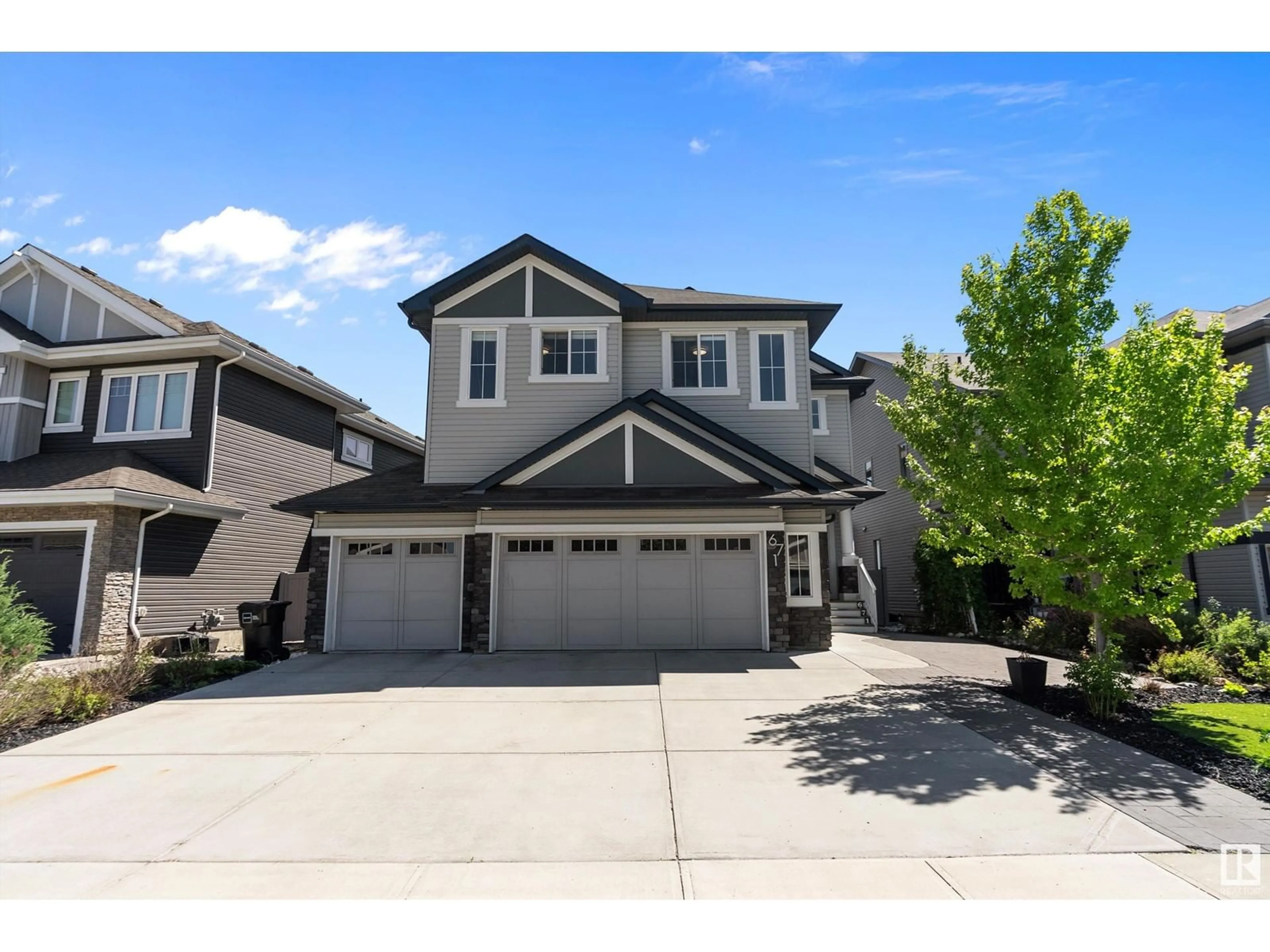 Home with vinyl exterior material, street for SW - 671 180 ST, Edmonton Alberta T6W2S8