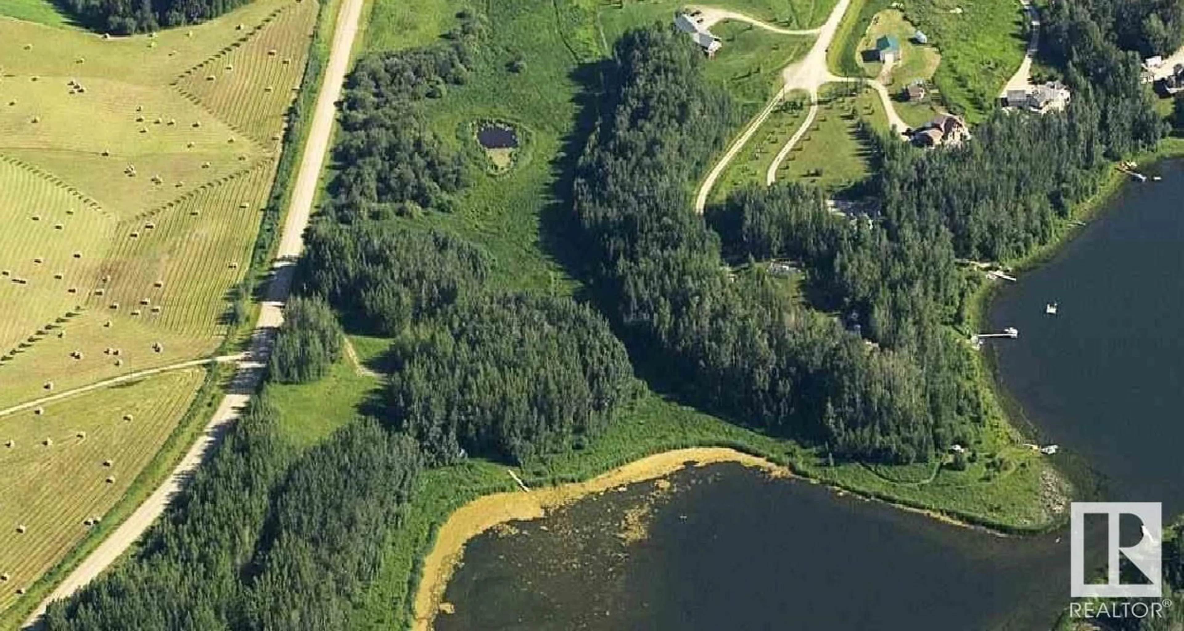 A pic from outside/outdoor area/front of a property/back of a property/a pic from drone, water/lake/river/ocean view for 52123 RGE ROAD 25, Rural Parkland County Alberta T0E0H0