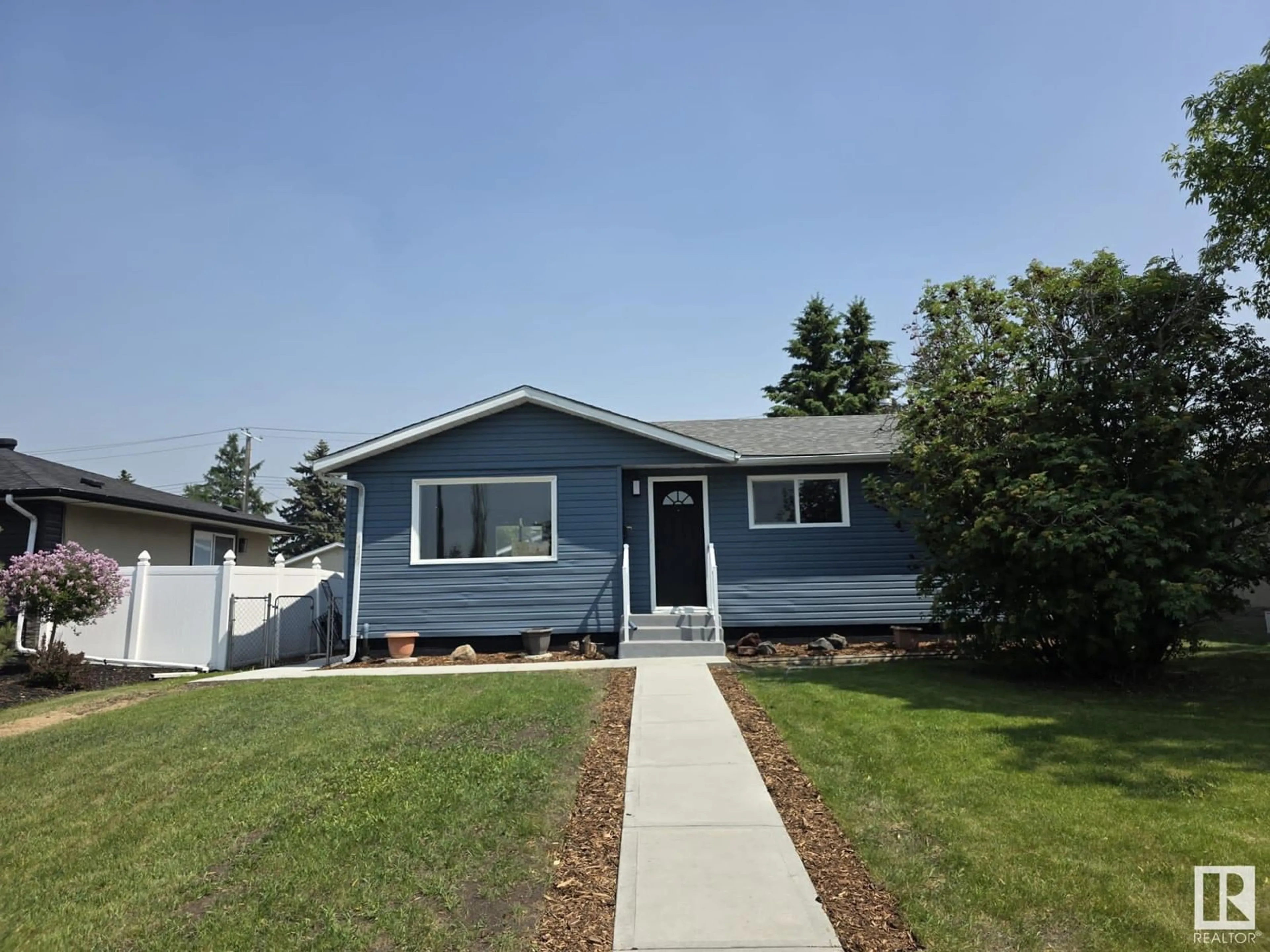 Home with vinyl exterior material, street for 13403 73 ST, Edmonton Alberta T5C0T7