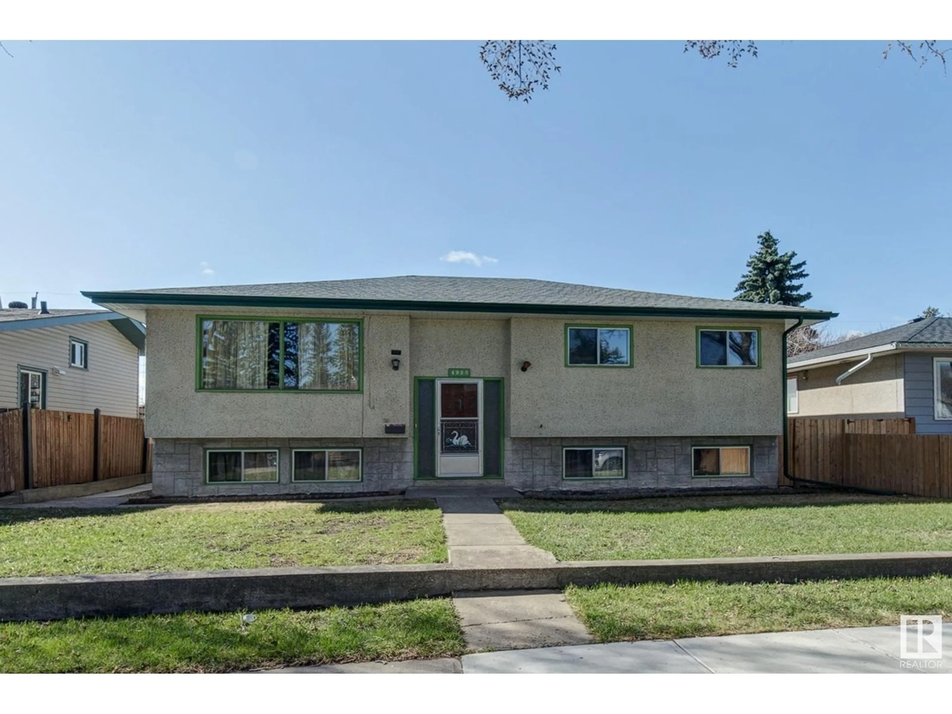 Home with vinyl exterior material, street for 4225 115 AV, Edmonton Alberta T5W0V7