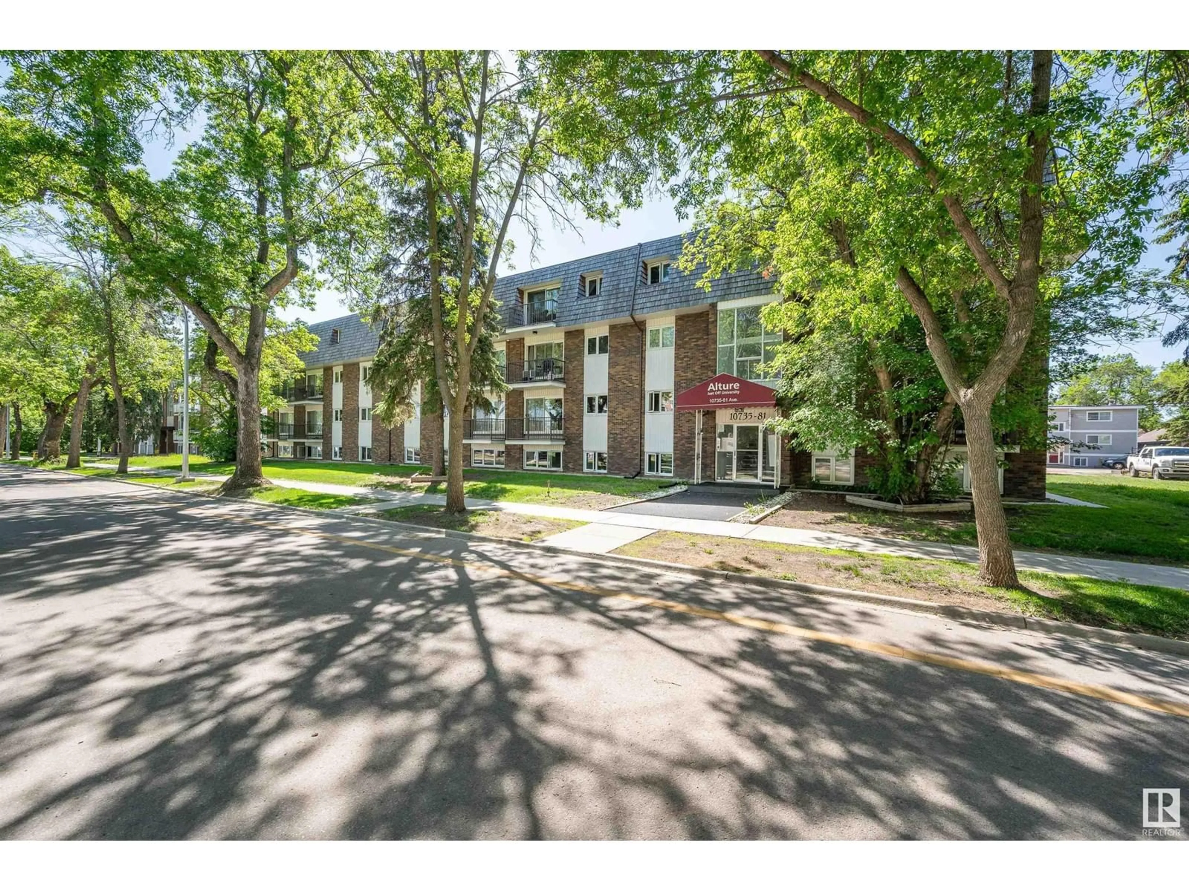 A pic from outside/outdoor area/front of a property/back of a property/a pic from drone, street for #105 - 10735 81 AV, Edmonton Alberta T6E1Y2