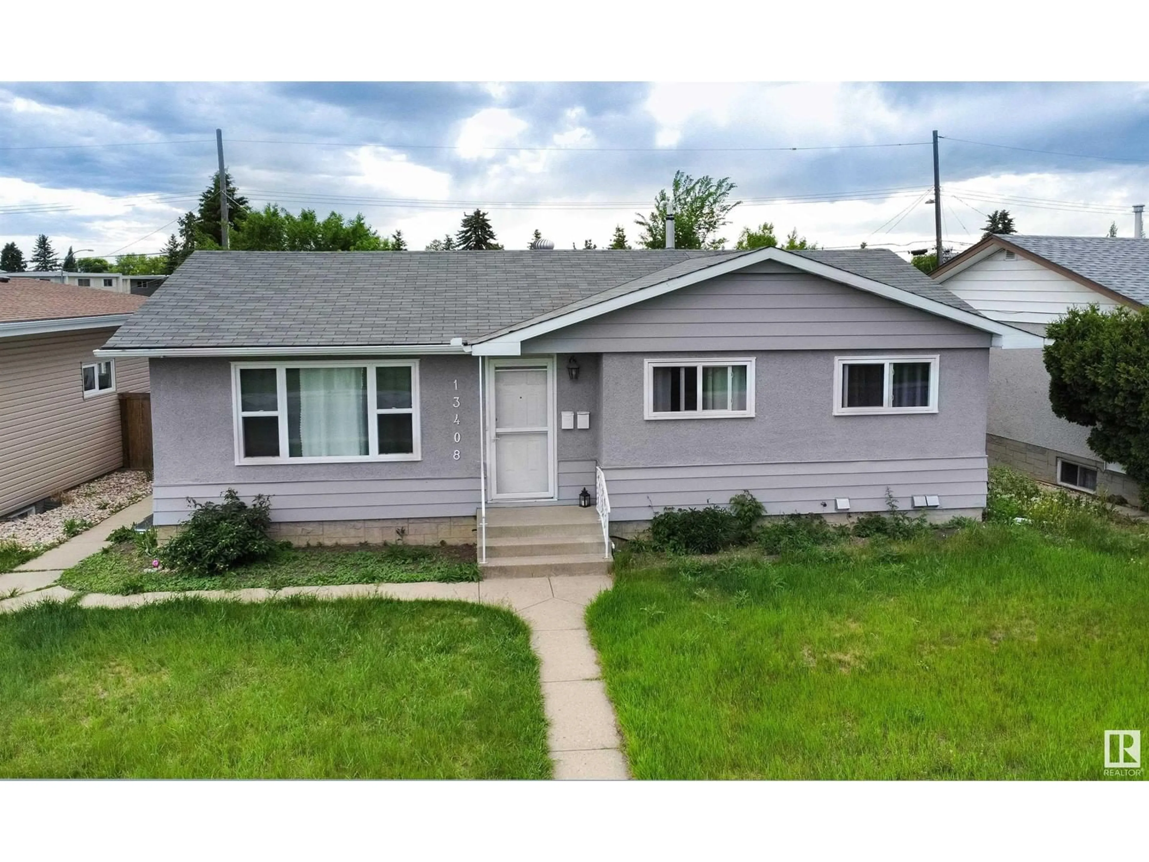 Home with vinyl exterior material, street for 13408 90 ST, Edmonton Alberta T5E3M8