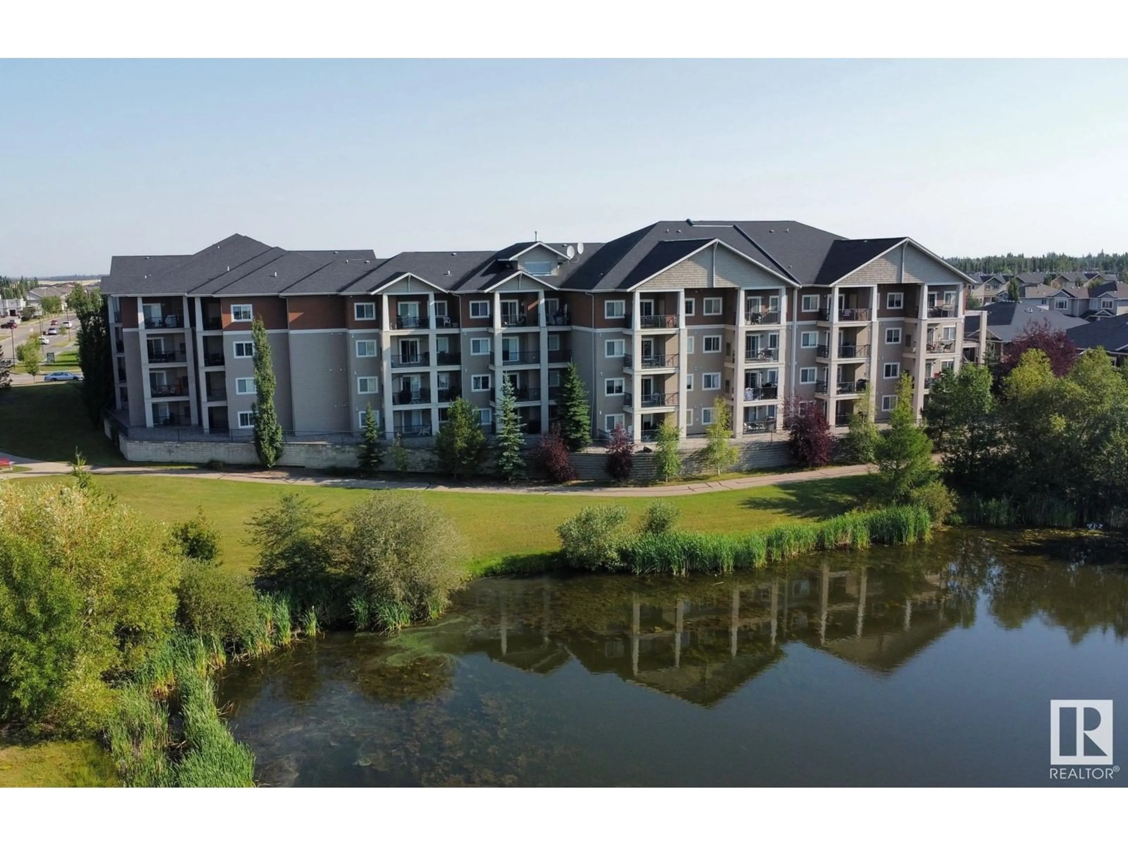 A pic from outside/outdoor area/front of a property/back of a property/a pic from drone, water/lake/river/ocean view for 211 105 WEST HAVEN DR, Leduc Alberta T9E0R9