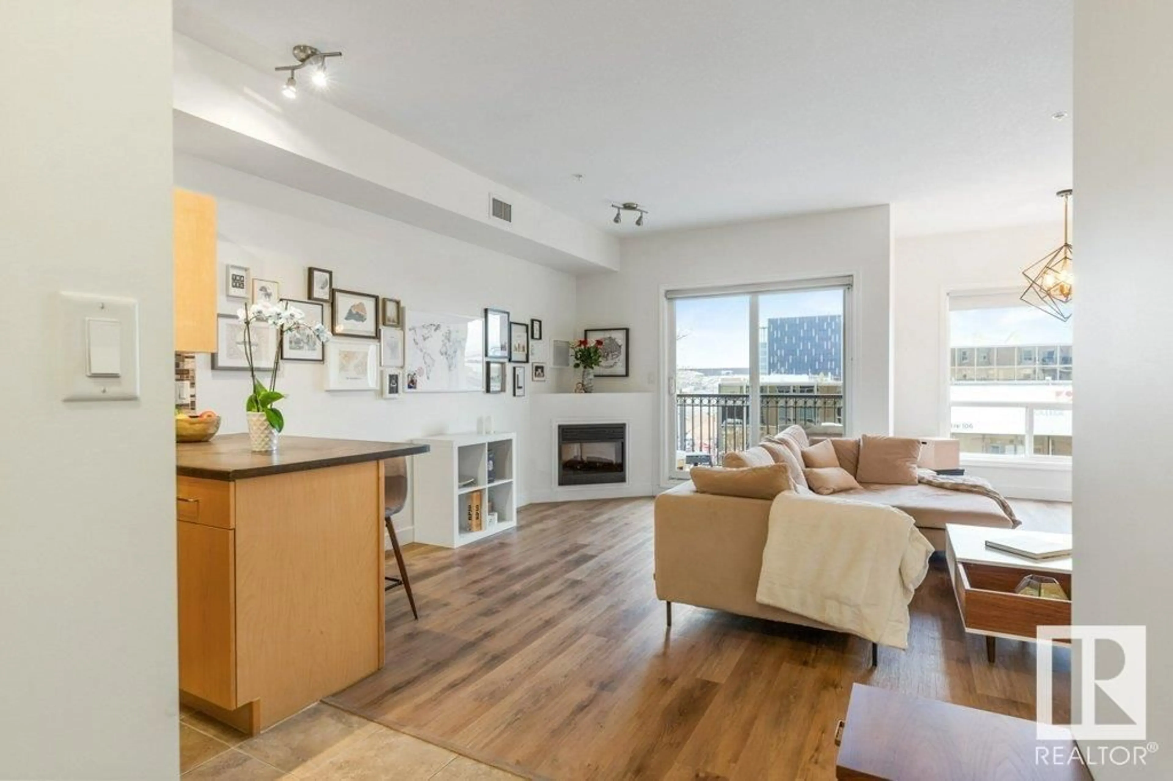Living room with furniture, wood/laminate floor for #405 - 10606 102 AV NW, Edmonton Alberta T5J5E9