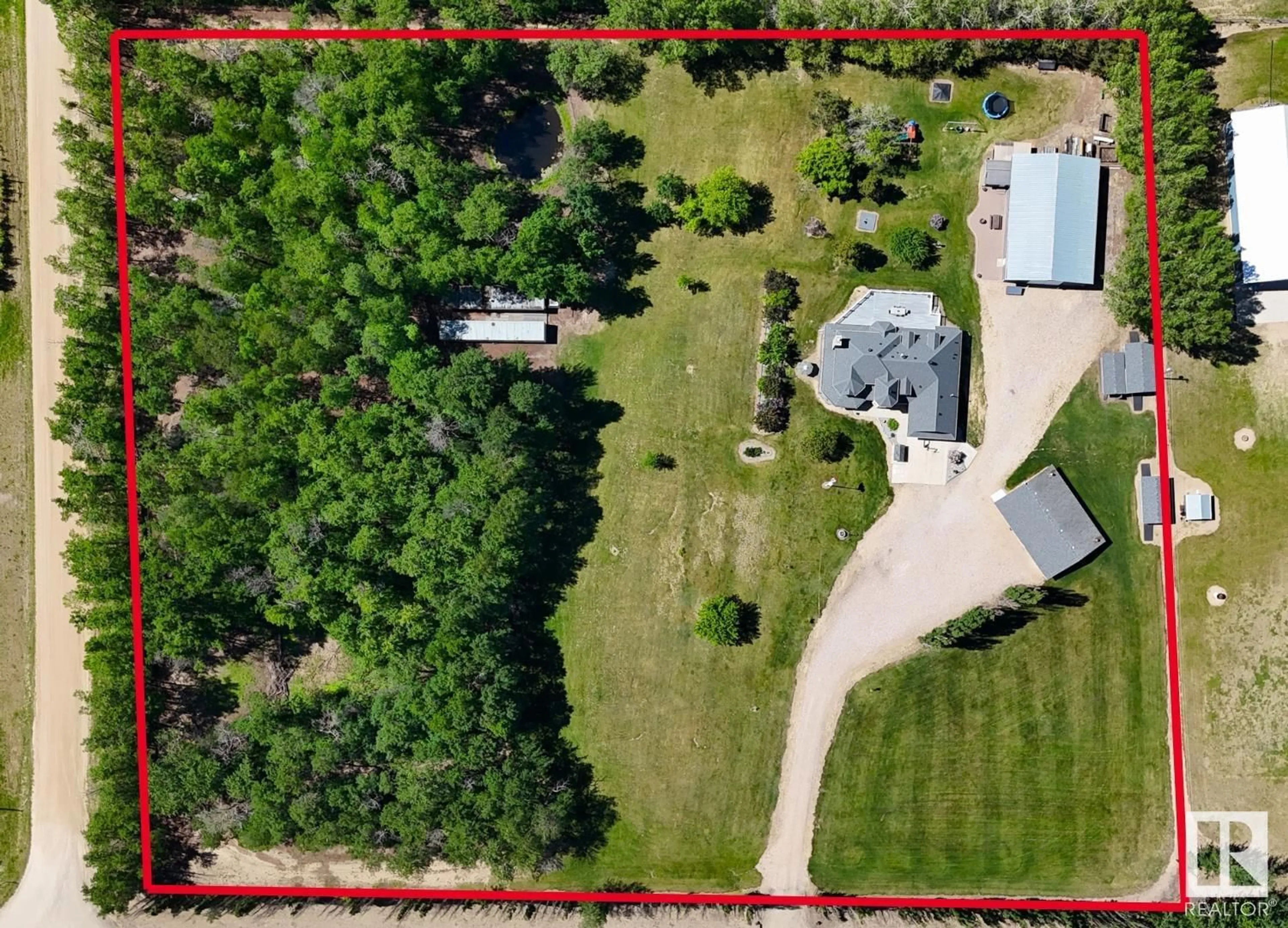 A pic from outside/outdoor area/front of a property/back of a property/a pic from drone, forest/trees view for 53502 RGE ROAD 11, Rural Parkland County Alberta T7Y0A6