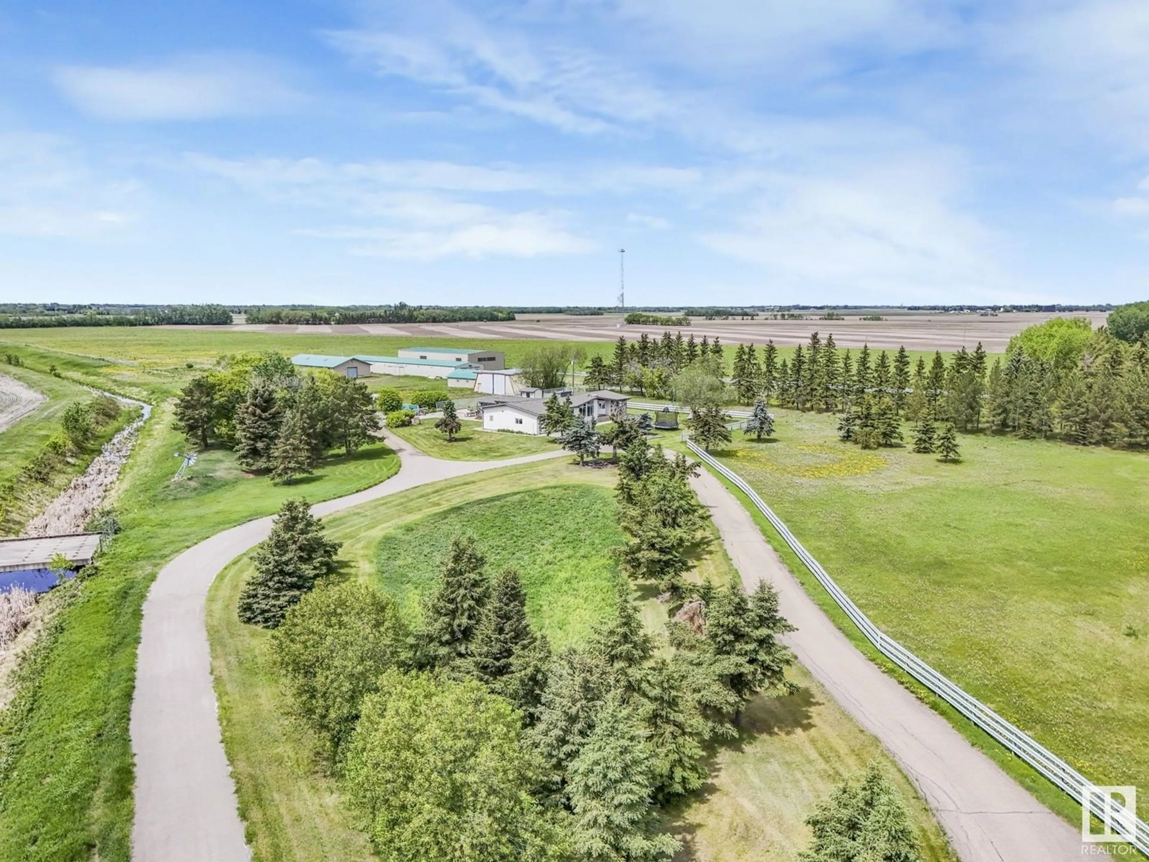 A pic from outside/outdoor area/front of a property/back of a property/a pic from drone, water/lake/river/ocean view for 54320 HWY 2, St. Albert Alberta T8T1T1