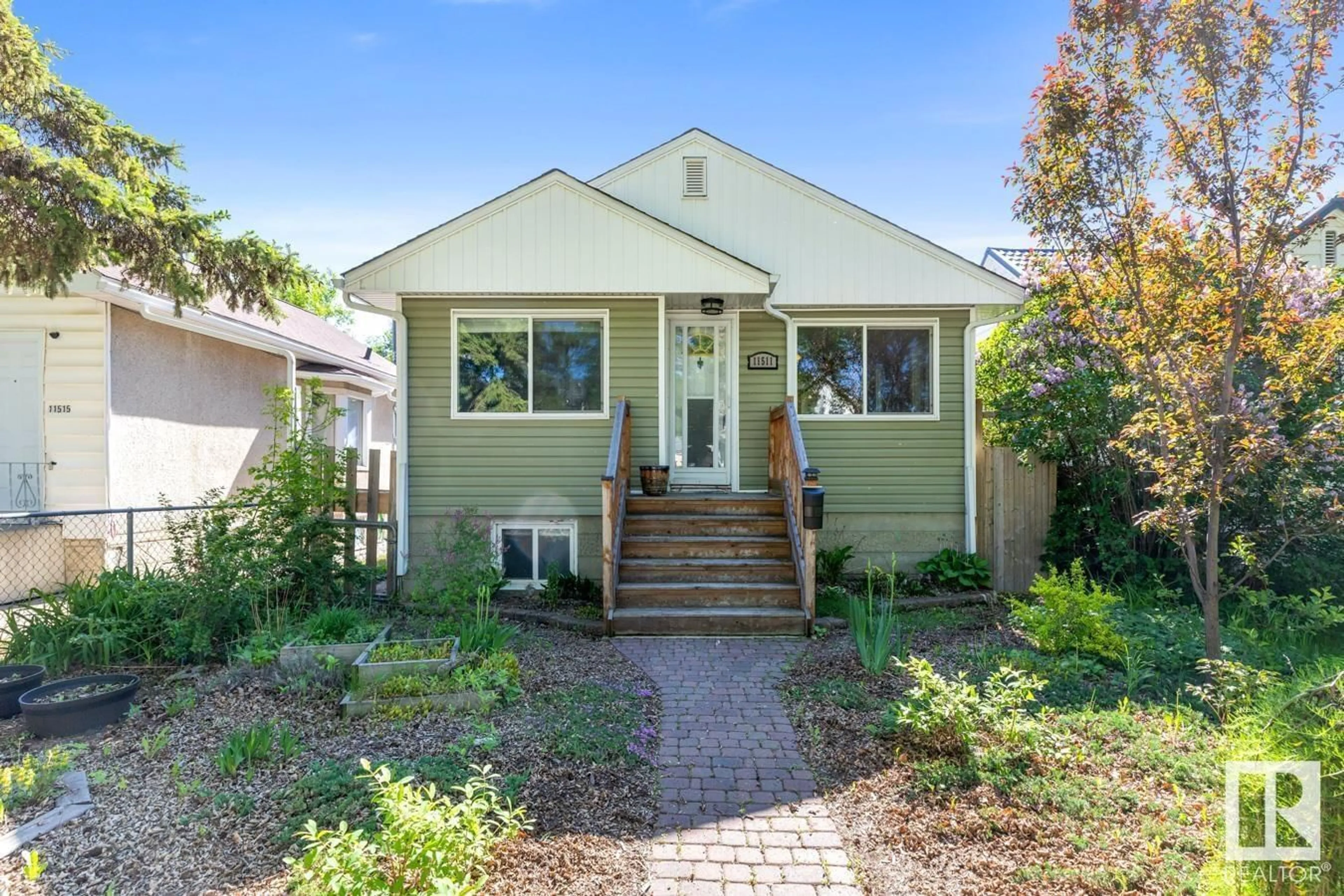 Home with vinyl exterior material, street for 11511 89 ST, Edmonton Alberta T5B3V1