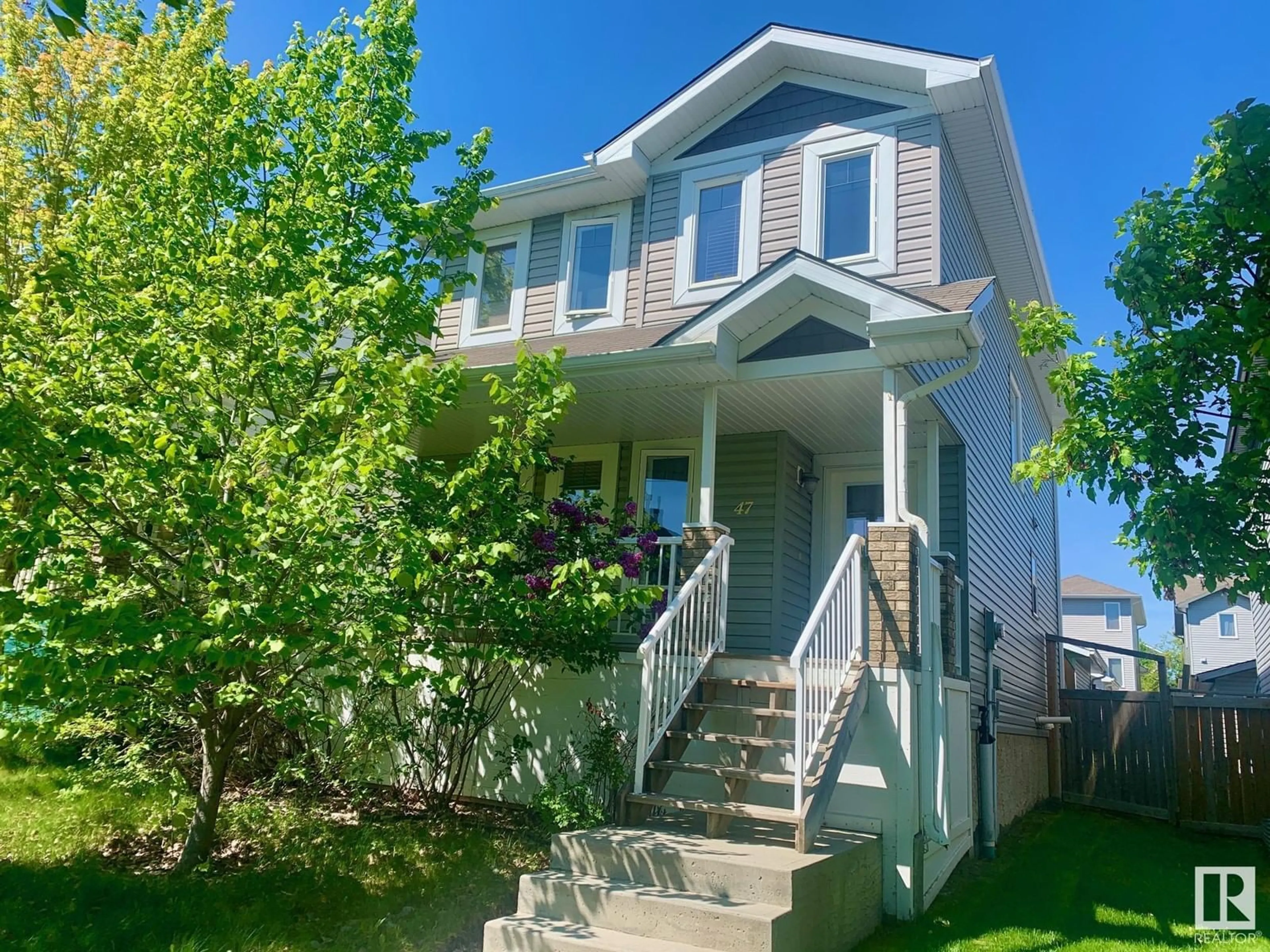 Home with vinyl exterior material, street for E - 47 SPRUCE VILLAGE DR, Spruce Grove Alberta T7X0H1