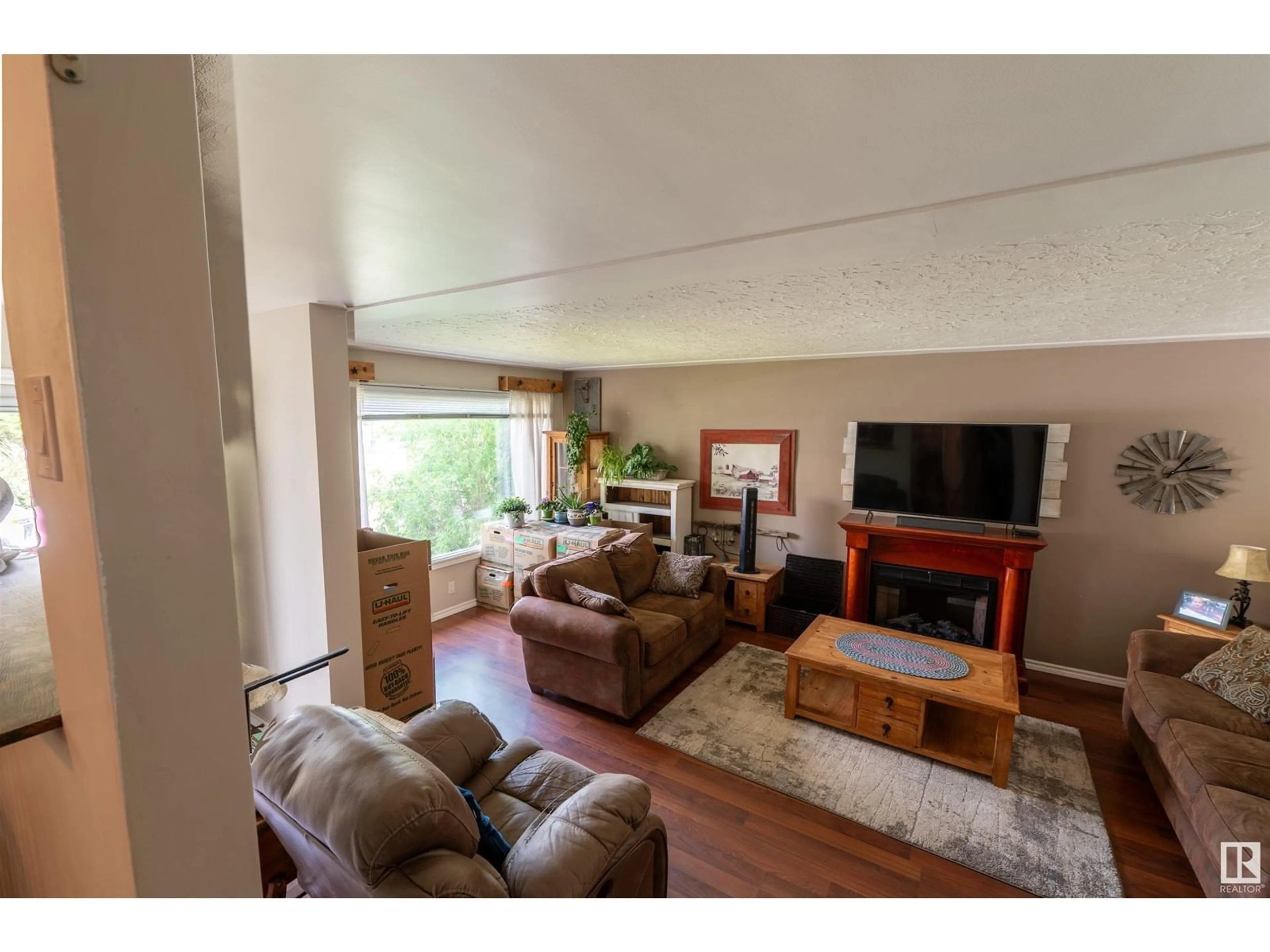 Living room with furniture, wood/laminate floor for 108 JESPERSEN AV, Spruce Grove Alberta T7X2H7