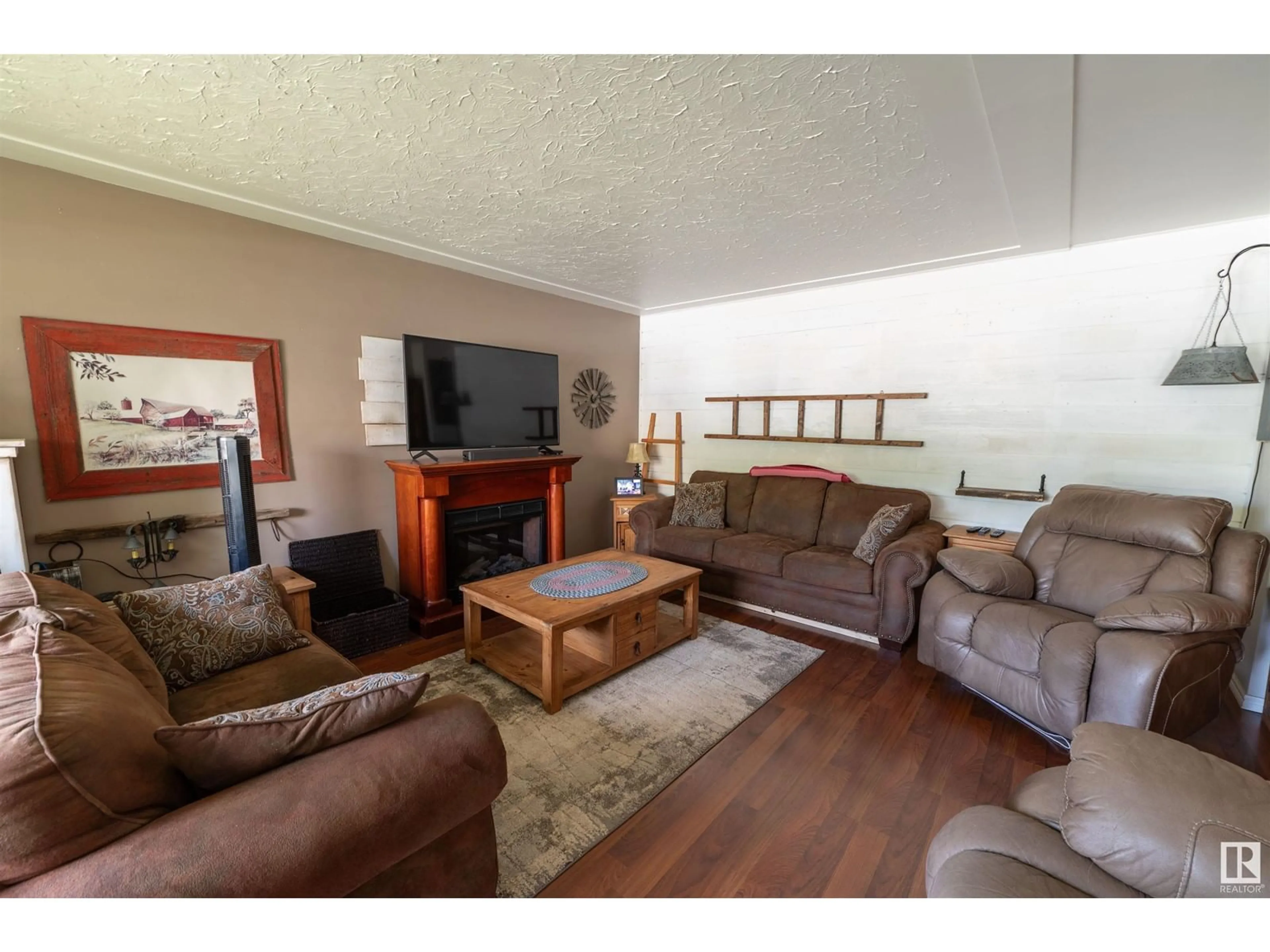 Living room with furniture, wood/laminate floor for 108 JESPERSEN AV, Spruce Grove Alberta T7X2H7