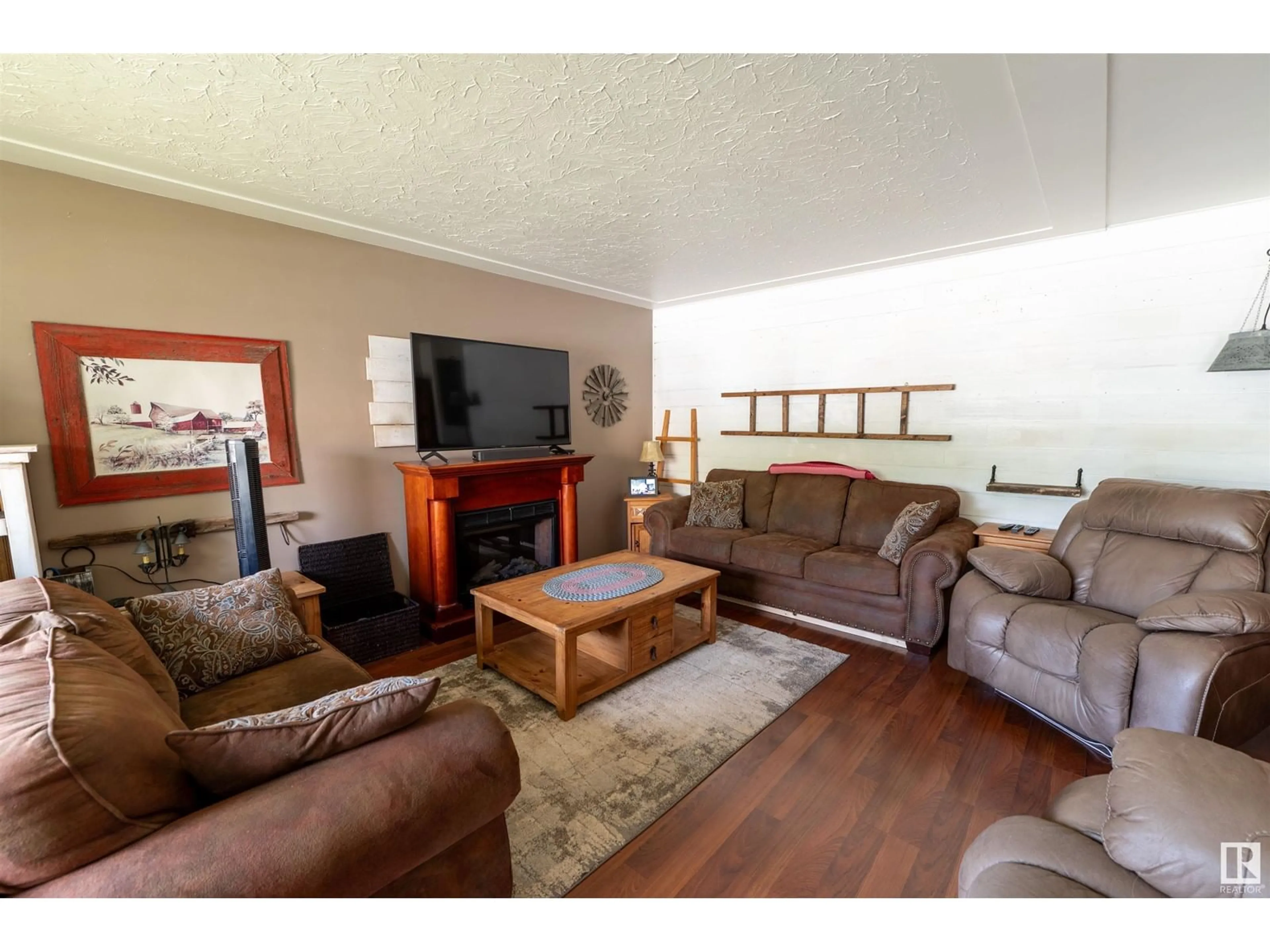 Living room with furniture, wood/laminate floor for 108 JESPERSEN AV, Spruce Grove Alberta T7X2H7