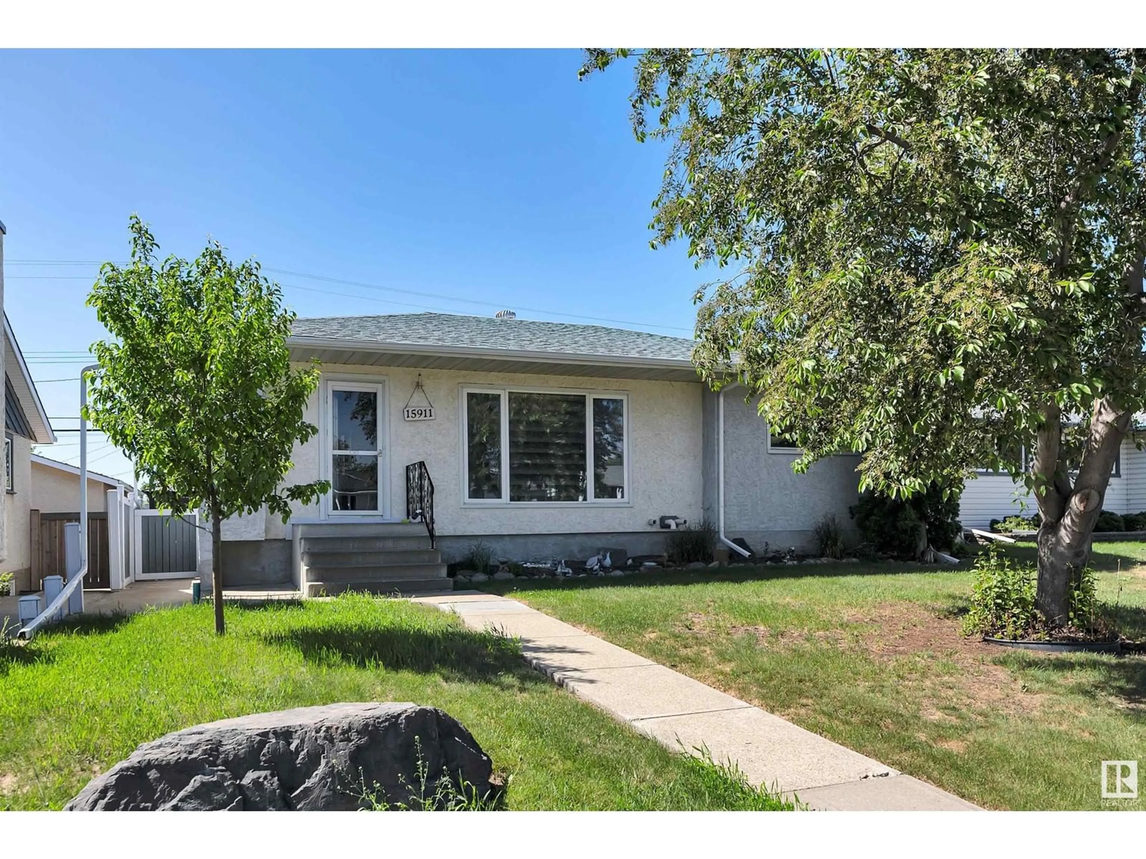 Home with vinyl exterior material, street for NW - 15911 110B AV, Edmonton Alberta T5P1J5