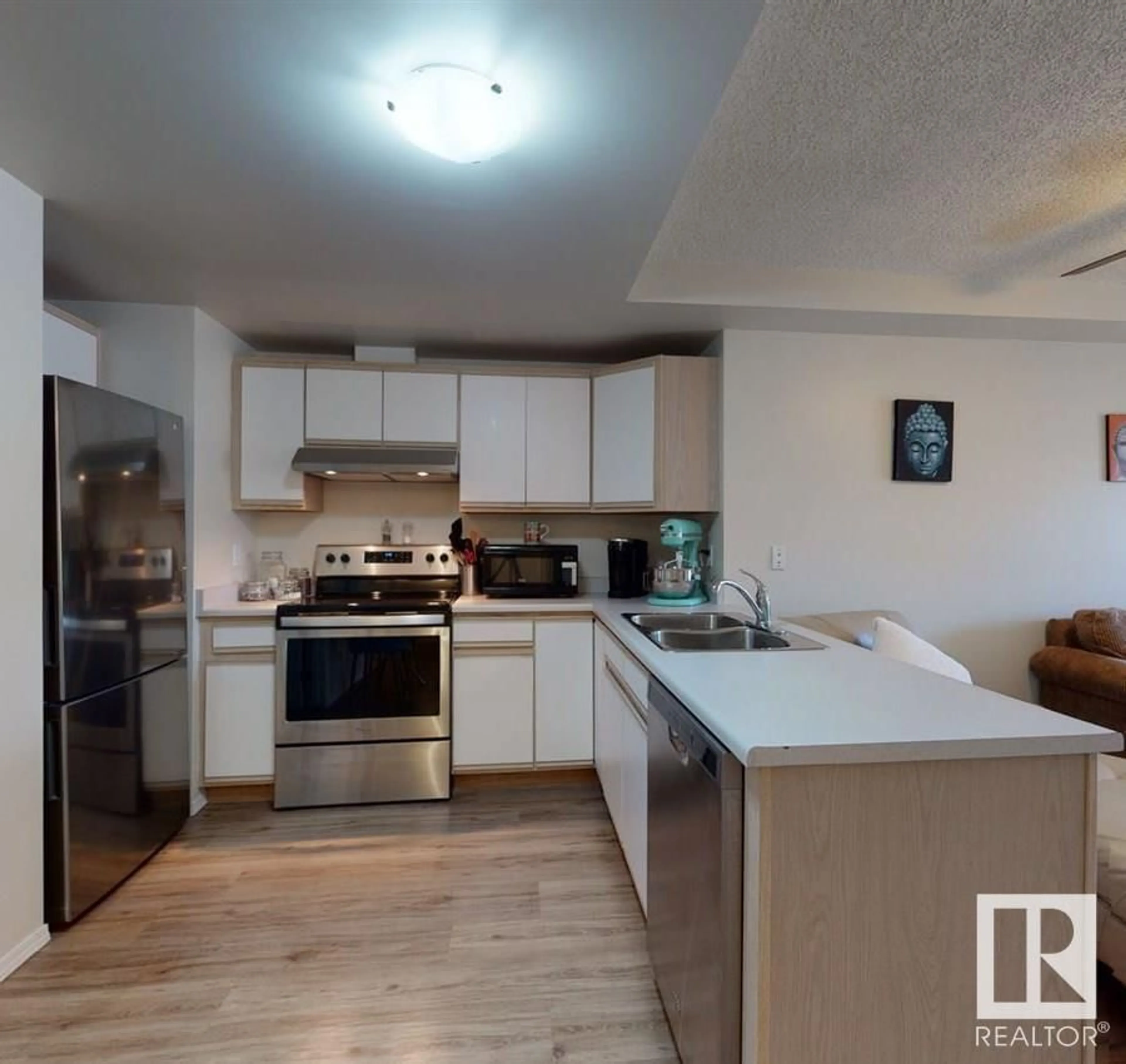 Open concept kitchen, wood/laminate floor for #102 - 10810 86 AV, Edmonton Alberta T6E2N2