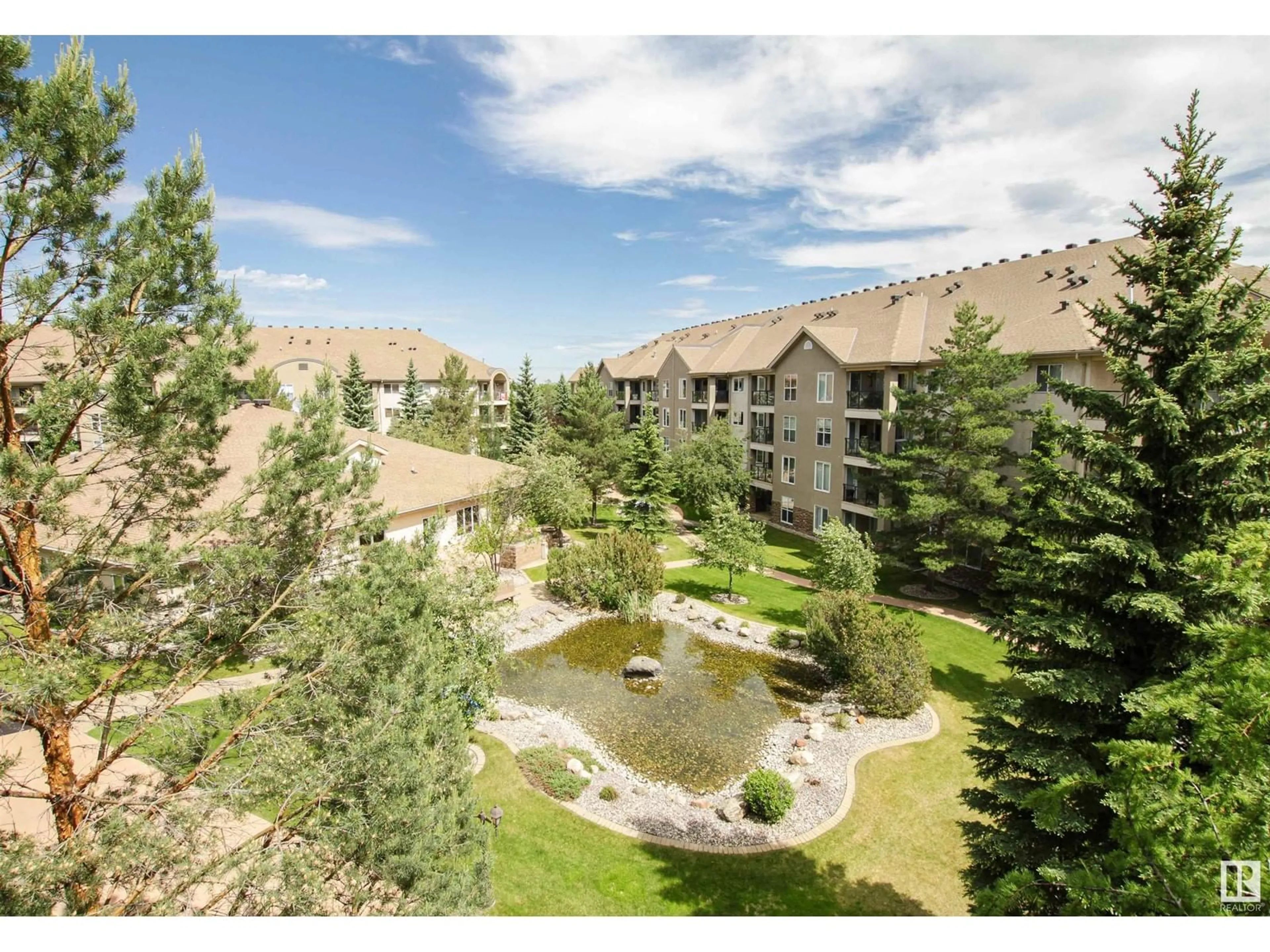 A pic from outside/outdoor area/front of a property/back of a property/a pic from drone, mountain view for #402 - 8912 156 ST, Edmonton Alberta T5R5Z2