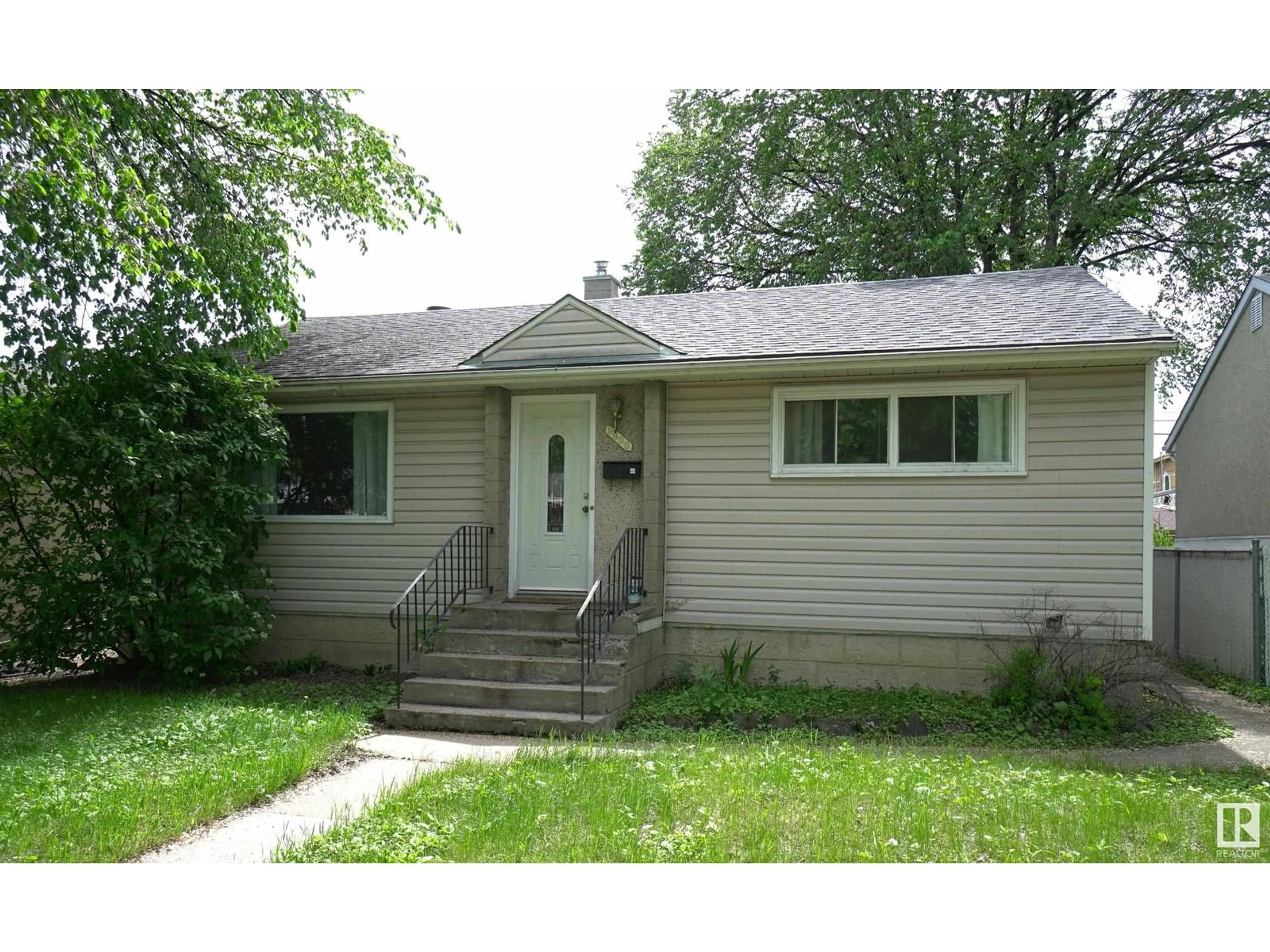 Home with vinyl exterior material, street for 9639 64 AV, Edmonton Alberta T6E0J2