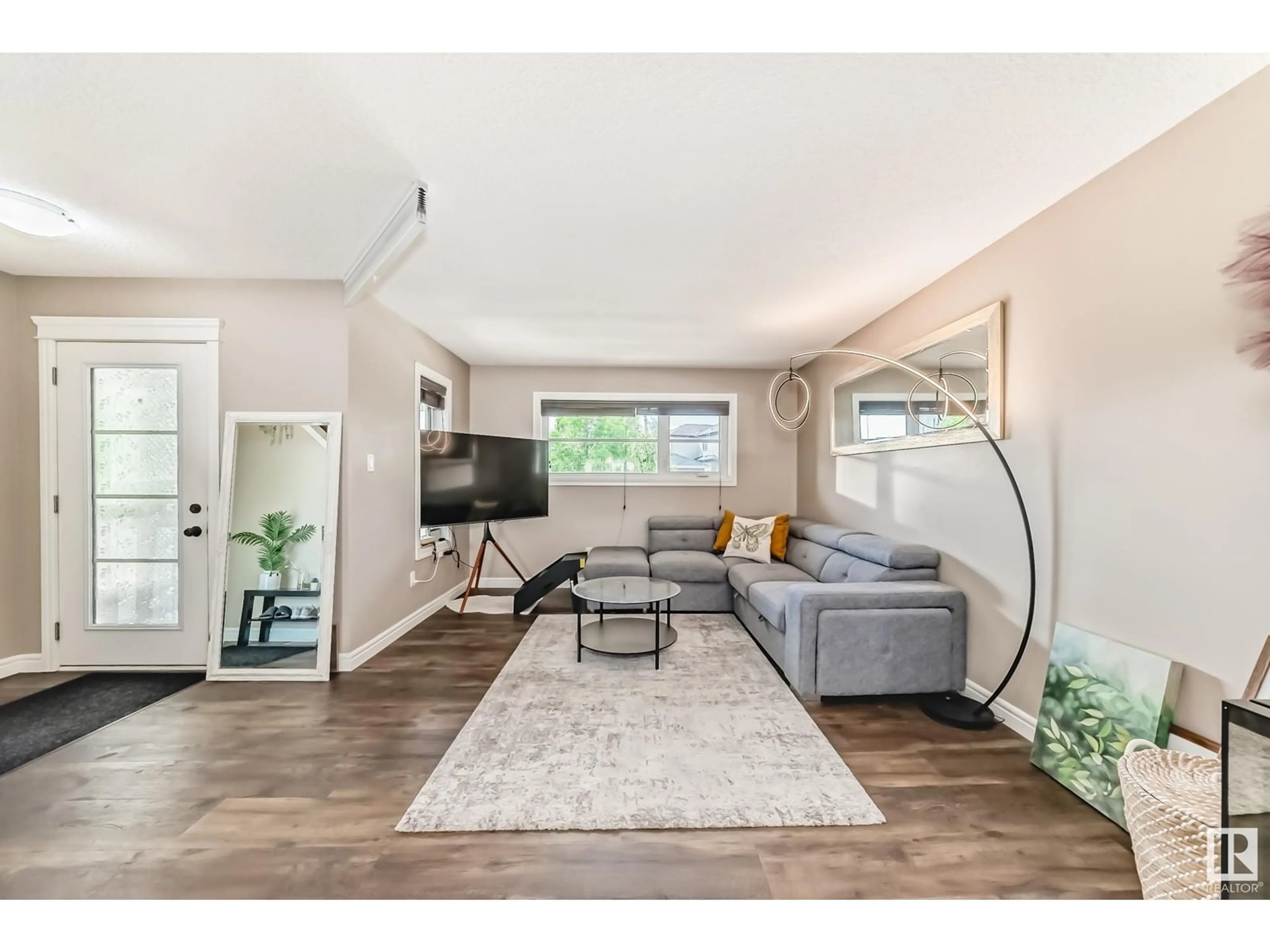Living room with furniture, wood/laminate floor for 2341 CASEY CR, Edmonton Alberta T6W3M9