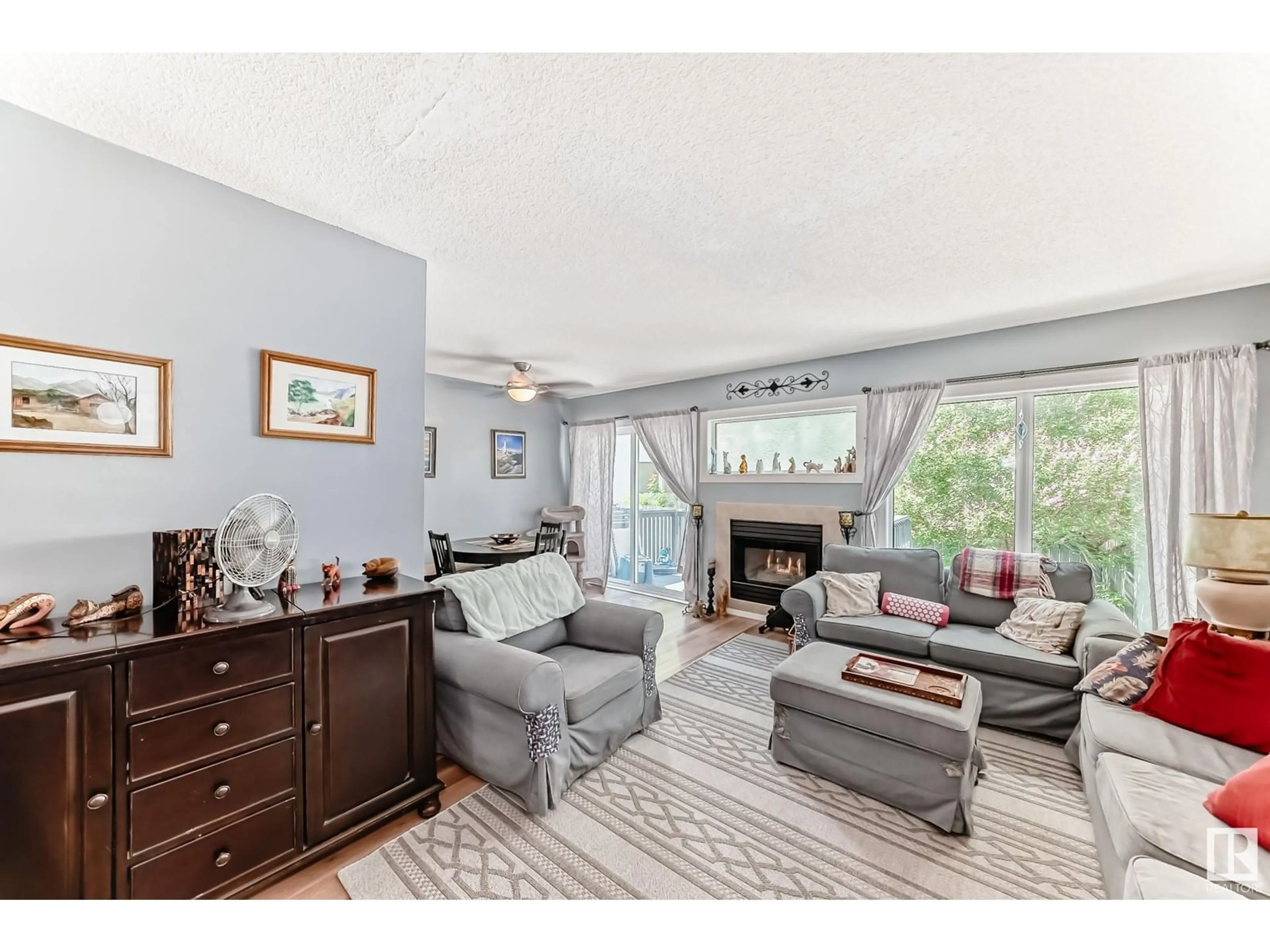 Living room with furniture, wood/laminate floor for 501 - 53 YOUVILLE E, Edmonton Alberta T6L6T8