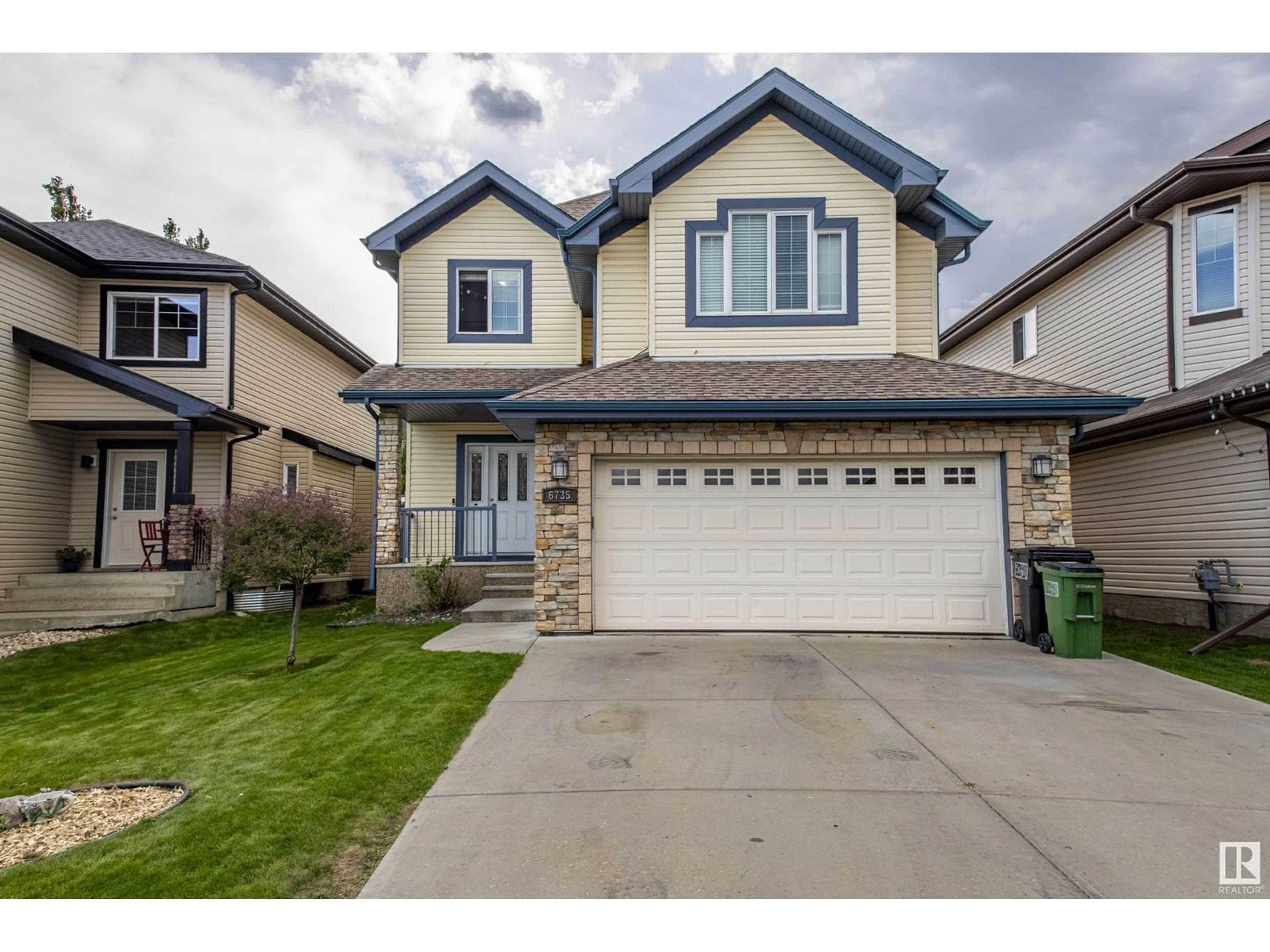 Home with vinyl exterior material, street for 6735 19 AV, Edmonton Alberta T6X0L8