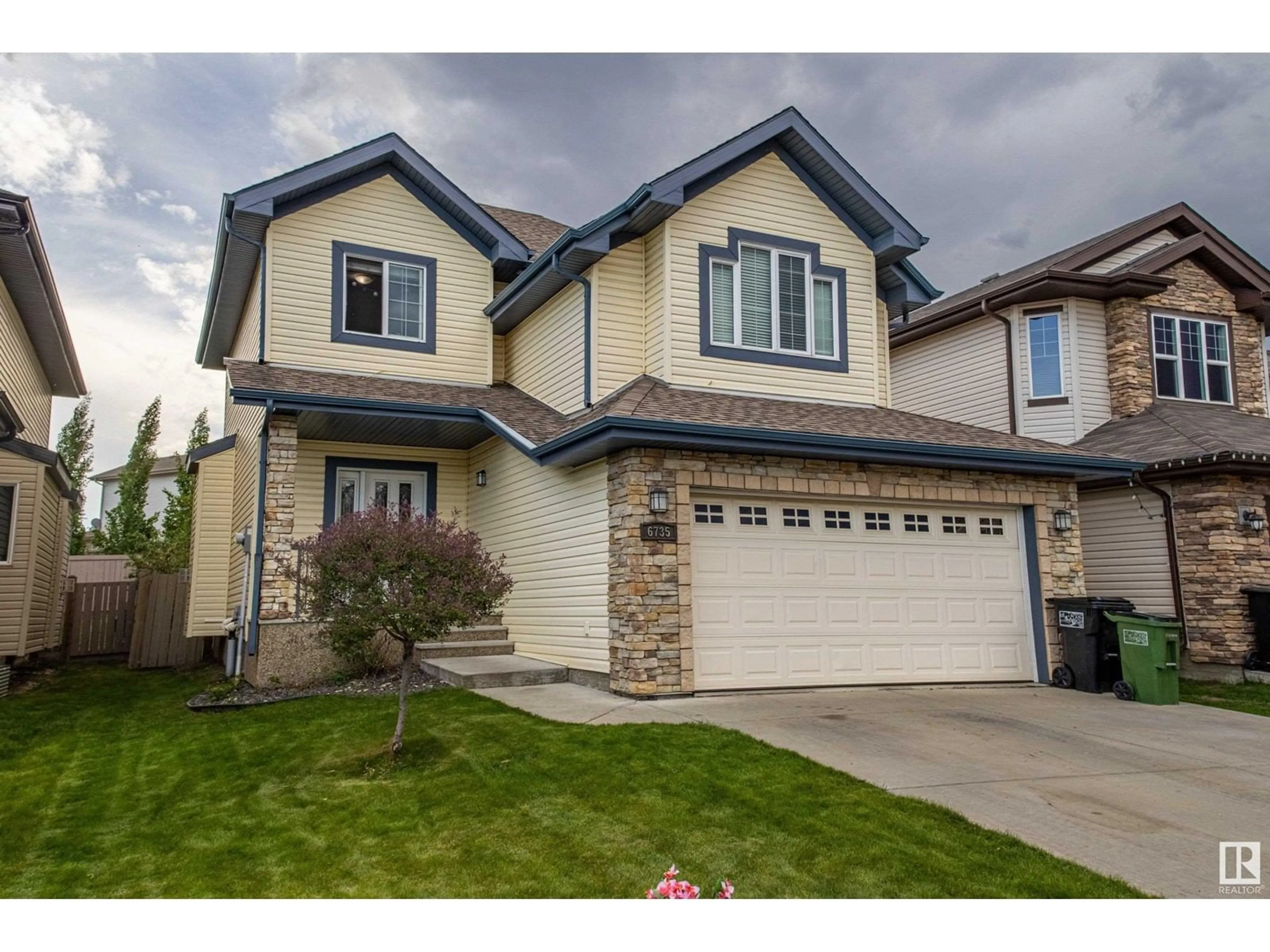 Home with vinyl exterior material, street for 6735 19 AV, Edmonton Alberta T6X0L8
