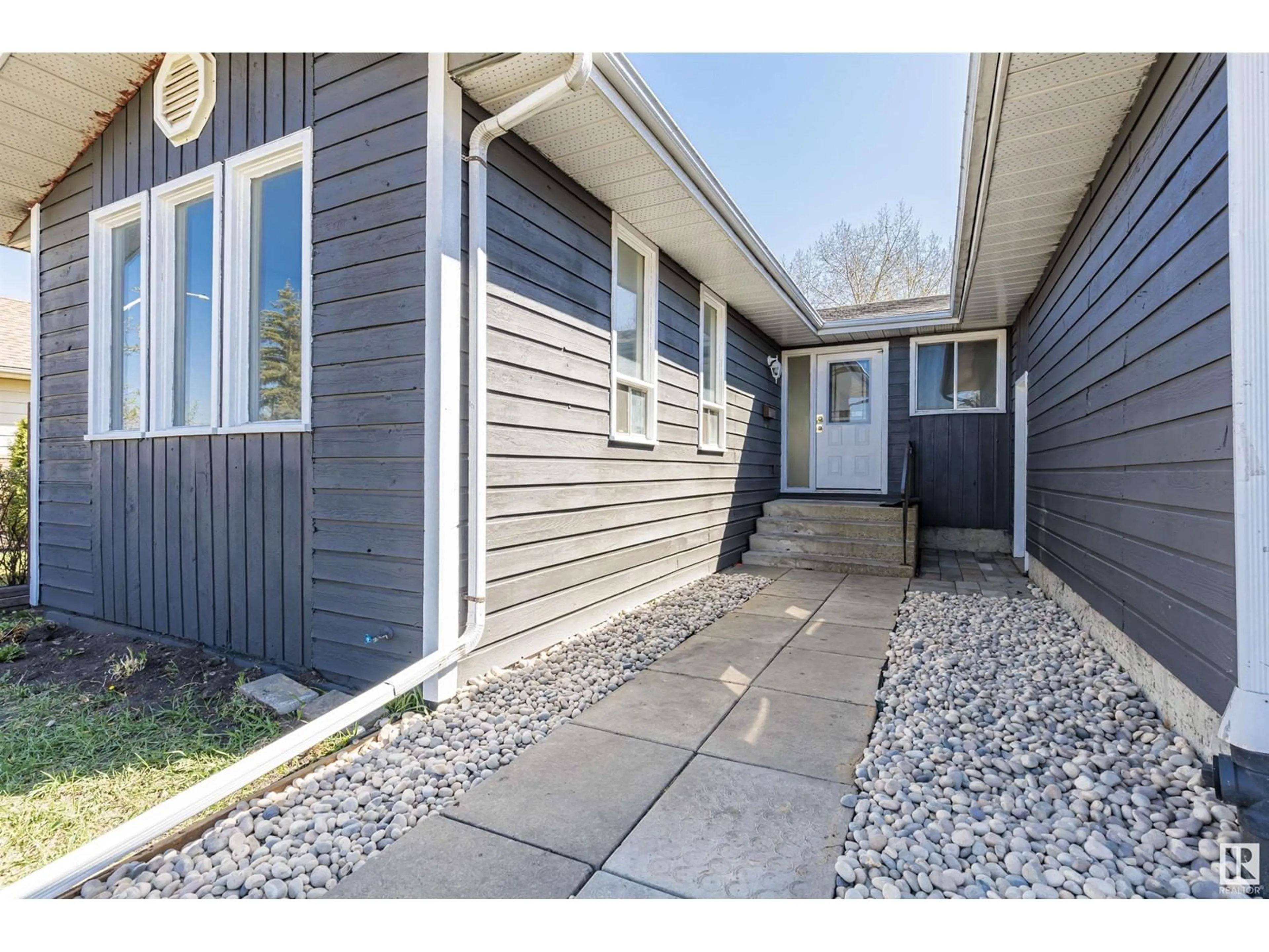 Home with vinyl exterior material, street for NW - 16723 98 ST, Edmonton Alberta T5X2S8