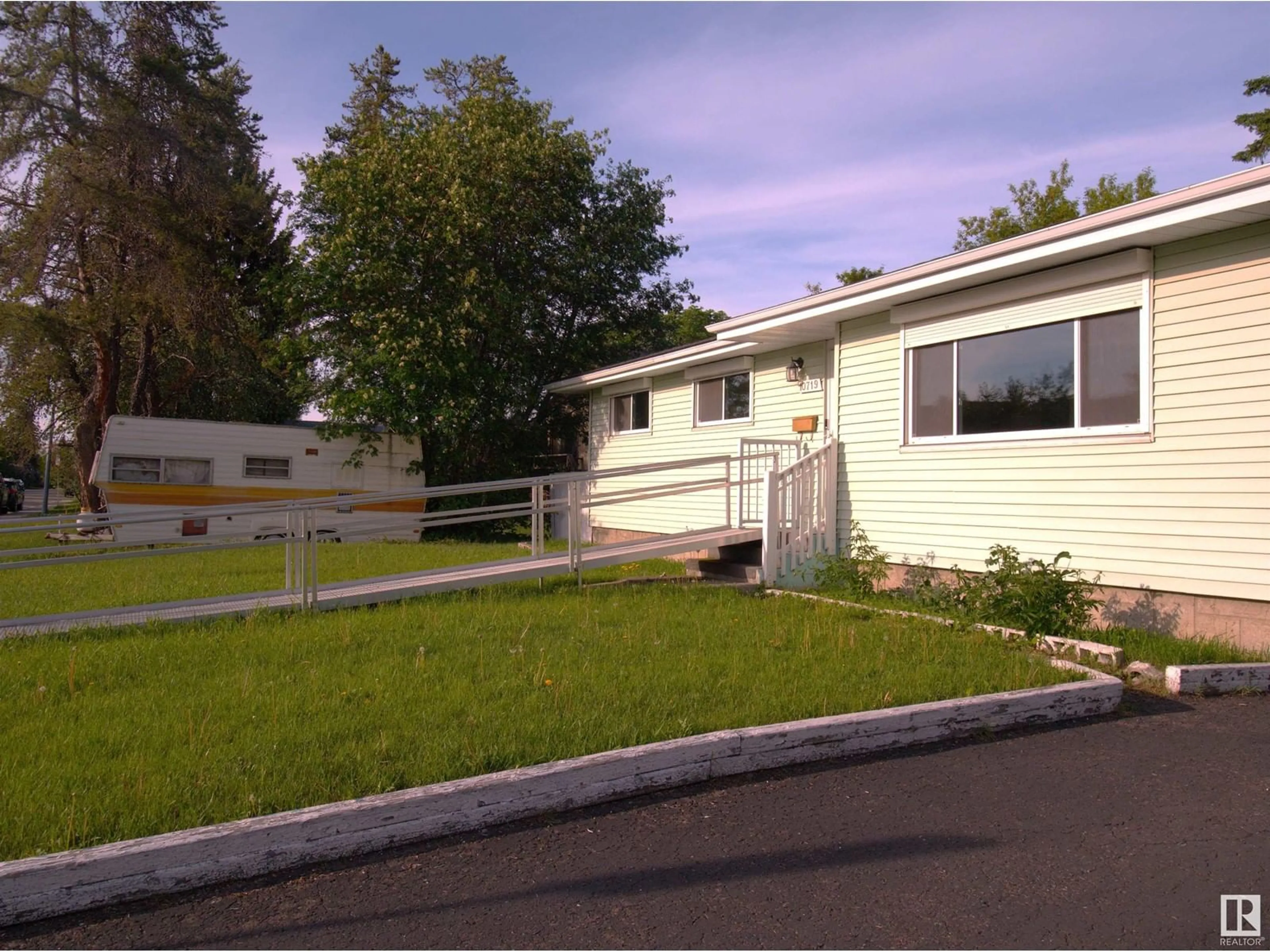 Home with vinyl exterior material, street for 10719 152 STREET, Edmonton Alberta T5P1Z2