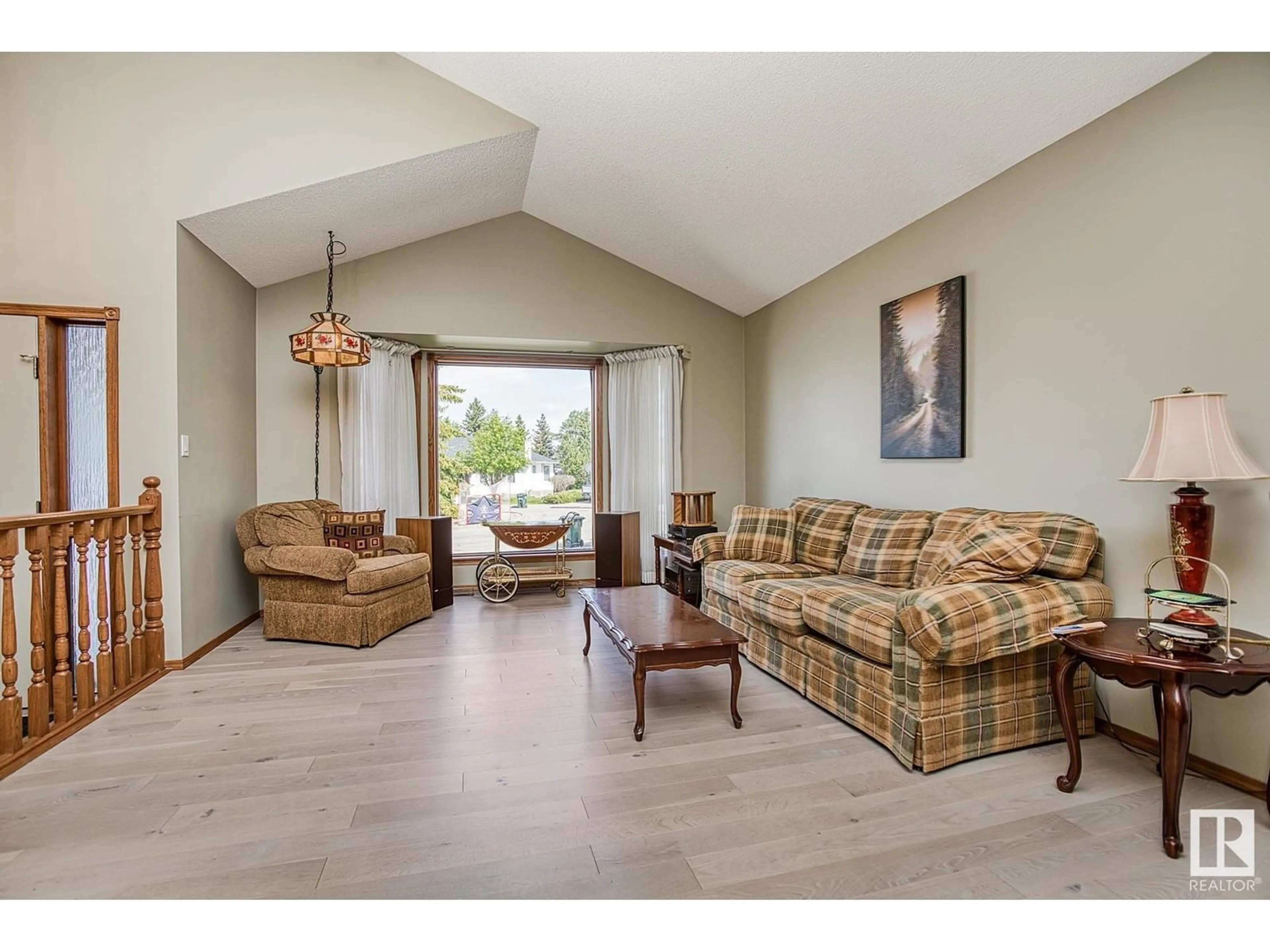 Living room with furniture, wood/laminate floor for 108 CARMEL RD, Sherwood Park Alberta T8A5B5