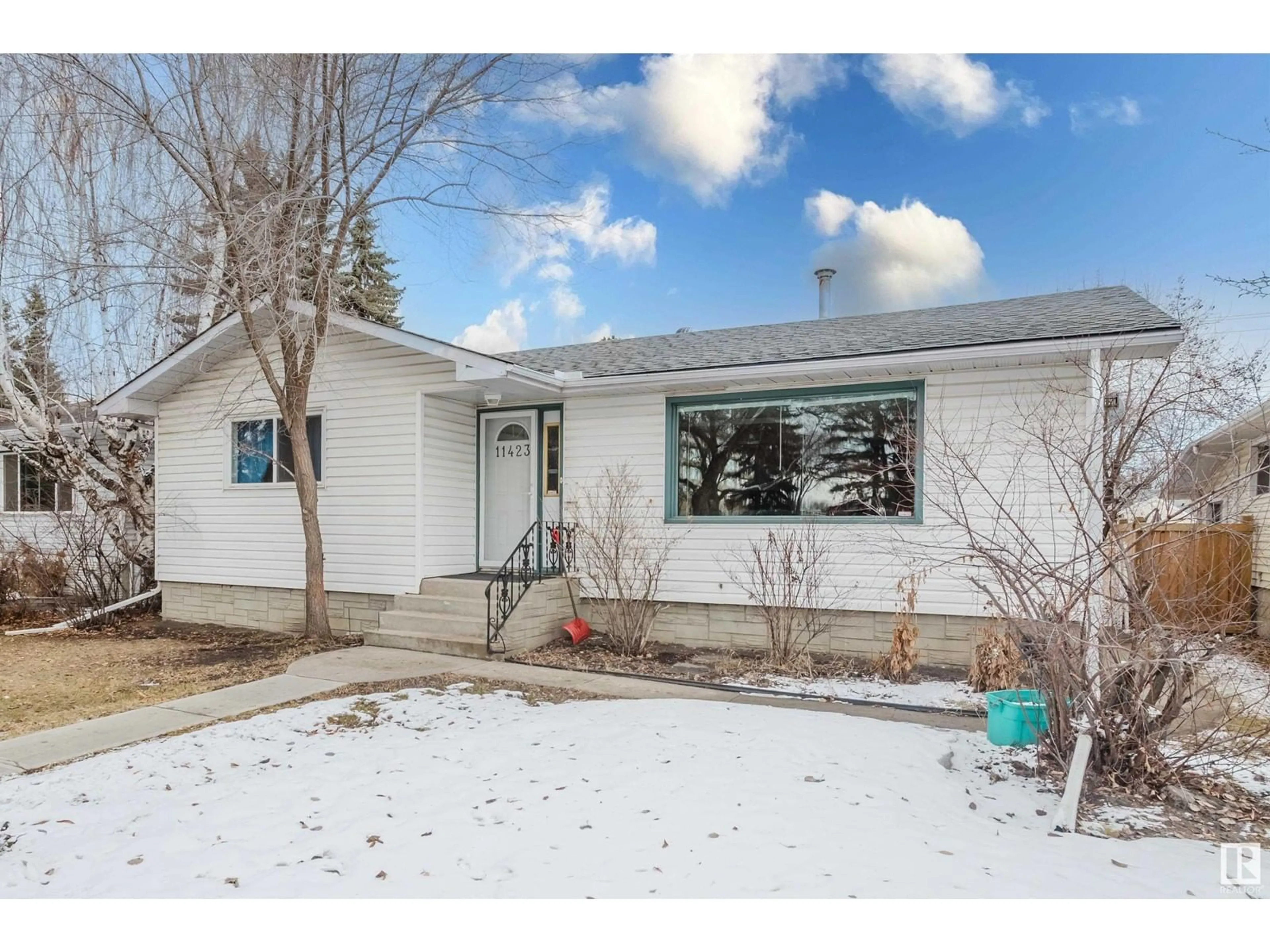 Home with vinyl exterior material, street for NW - 11423 127 ST, Edmonton Alberta T5M0V2
