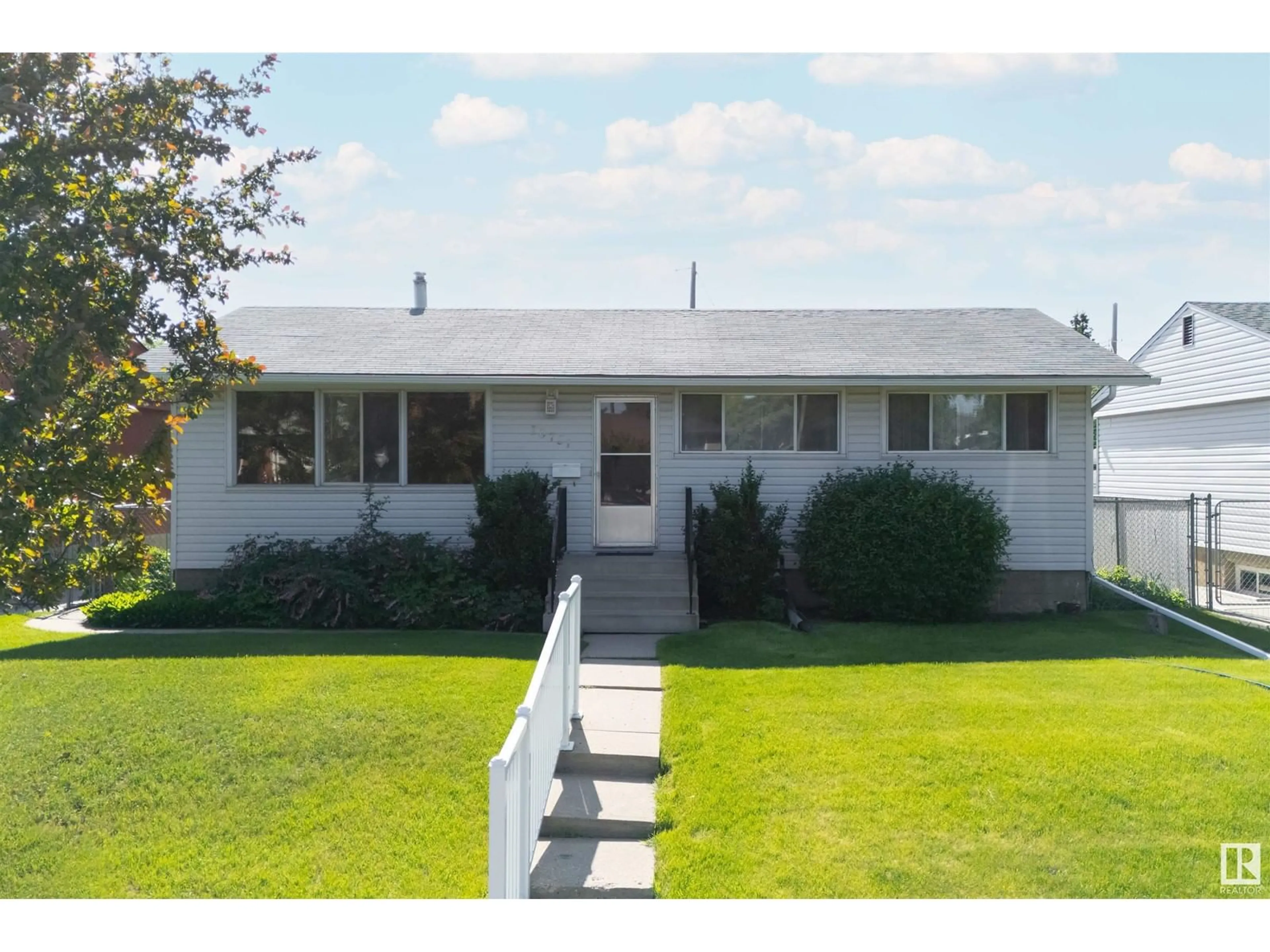 Home with vinyl exterior material, street for NW - 10751 164 ST, Edmonton Alberta T5P3S1