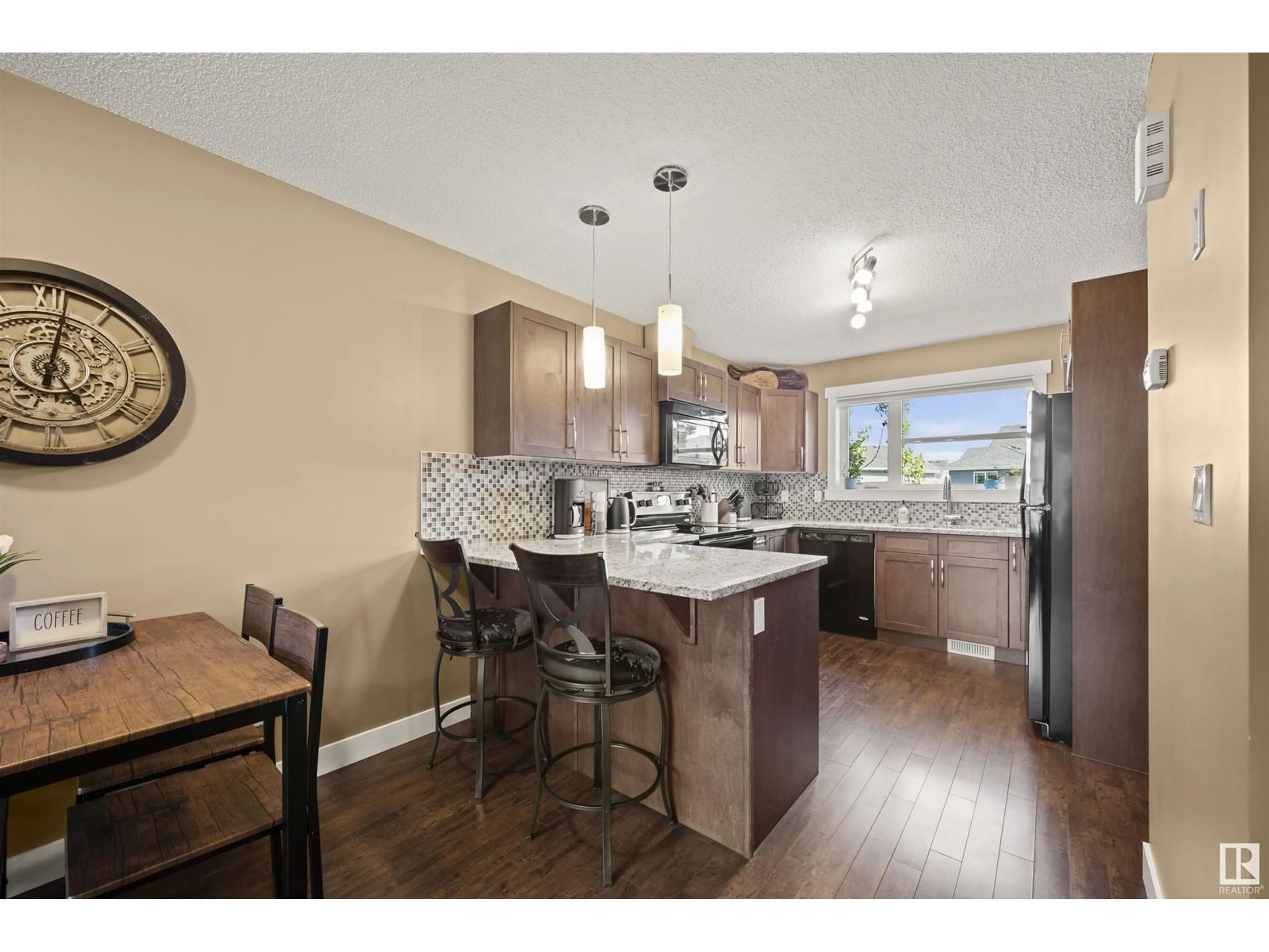 Open concept kitchen, wood/laminate floor for 401 - 265 SOUTHFORK DR, Leduc Alberta T9E0X1